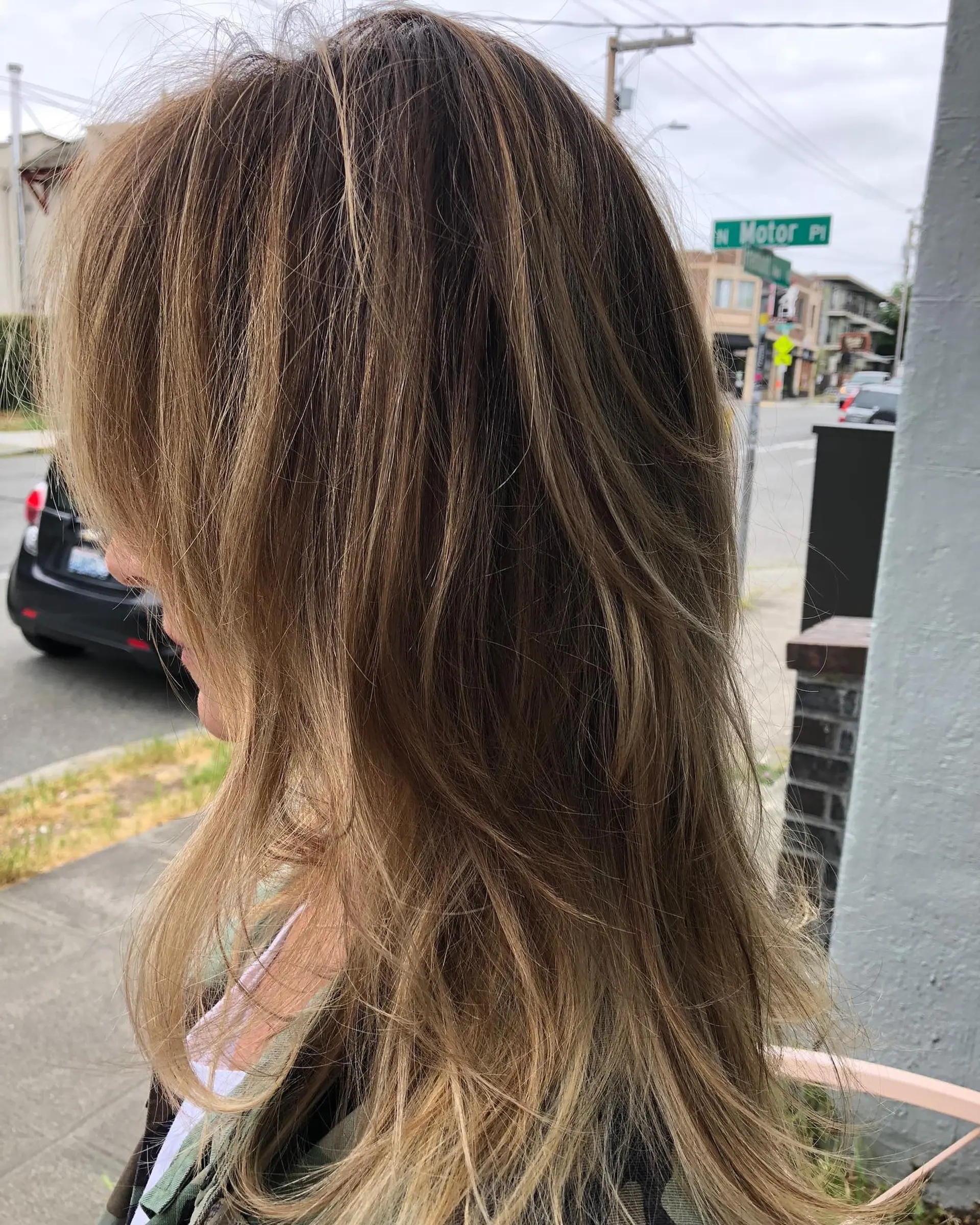 Long layered cut featuring soft, natural highlights and face-framing texture for effortless movement. 1