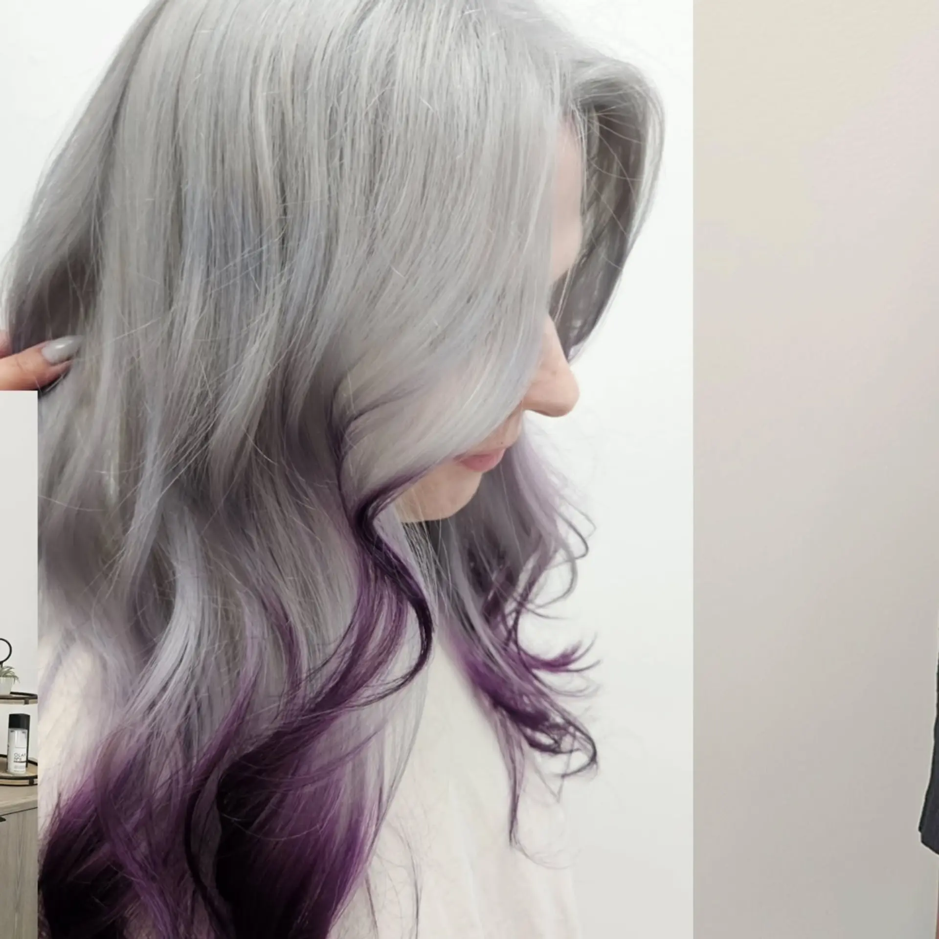 Silvery ash-gray hair flowing into vivid purple dip-dyed tips, styled with soft, loose waves. 1