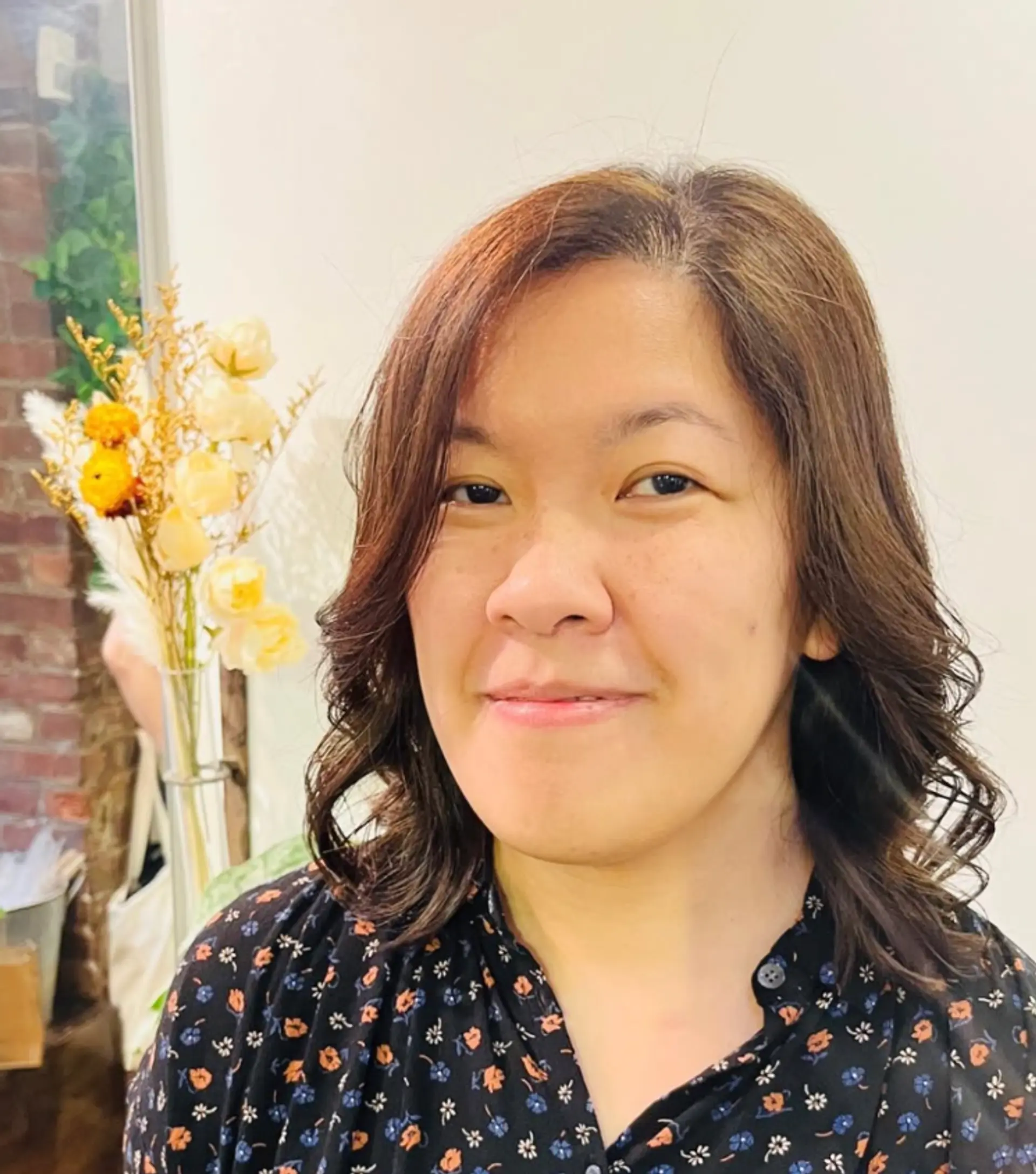 A medium-length wavy hairstyle with a soft, bronde color. 1