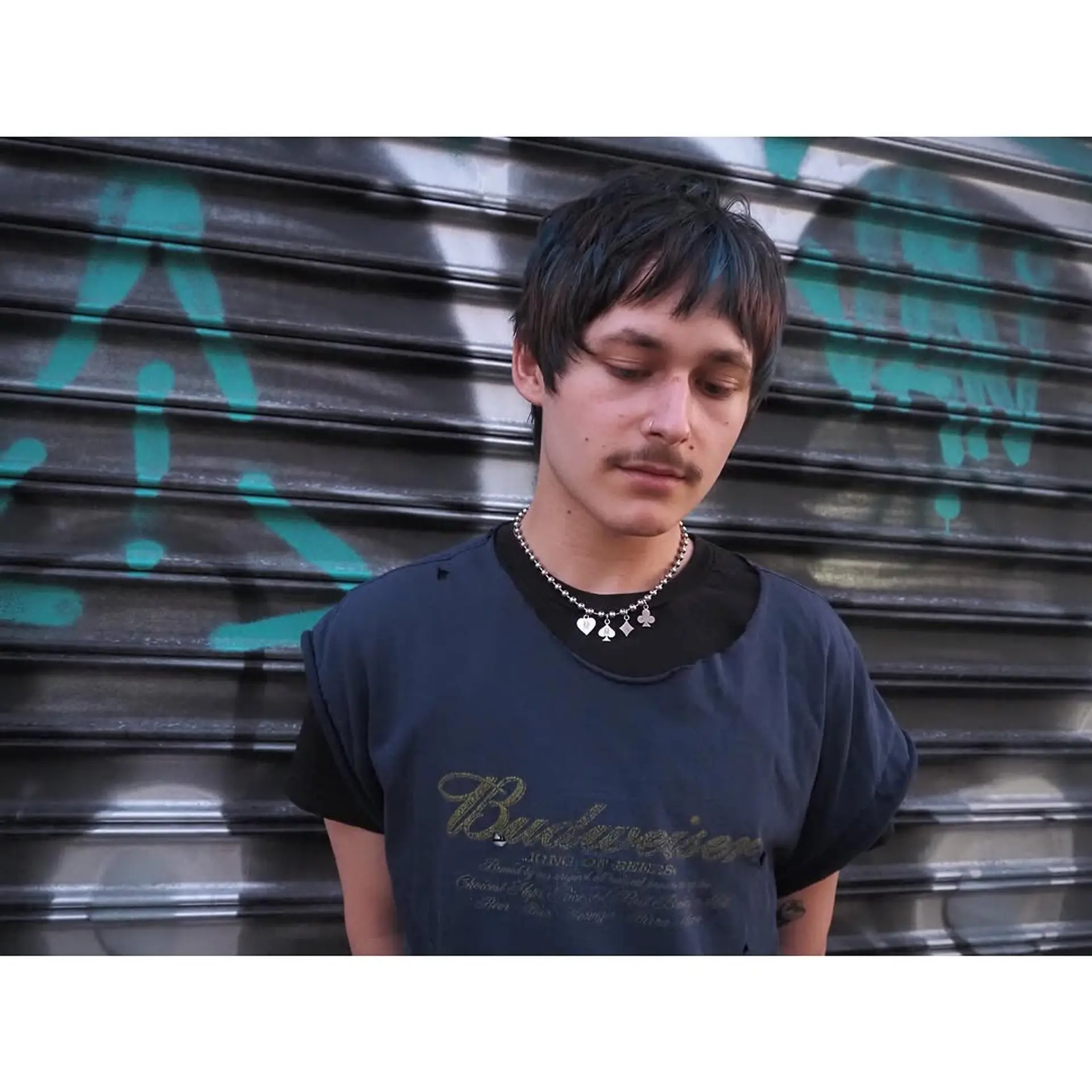 A modern shag with textured layers and curtain bangs. 2