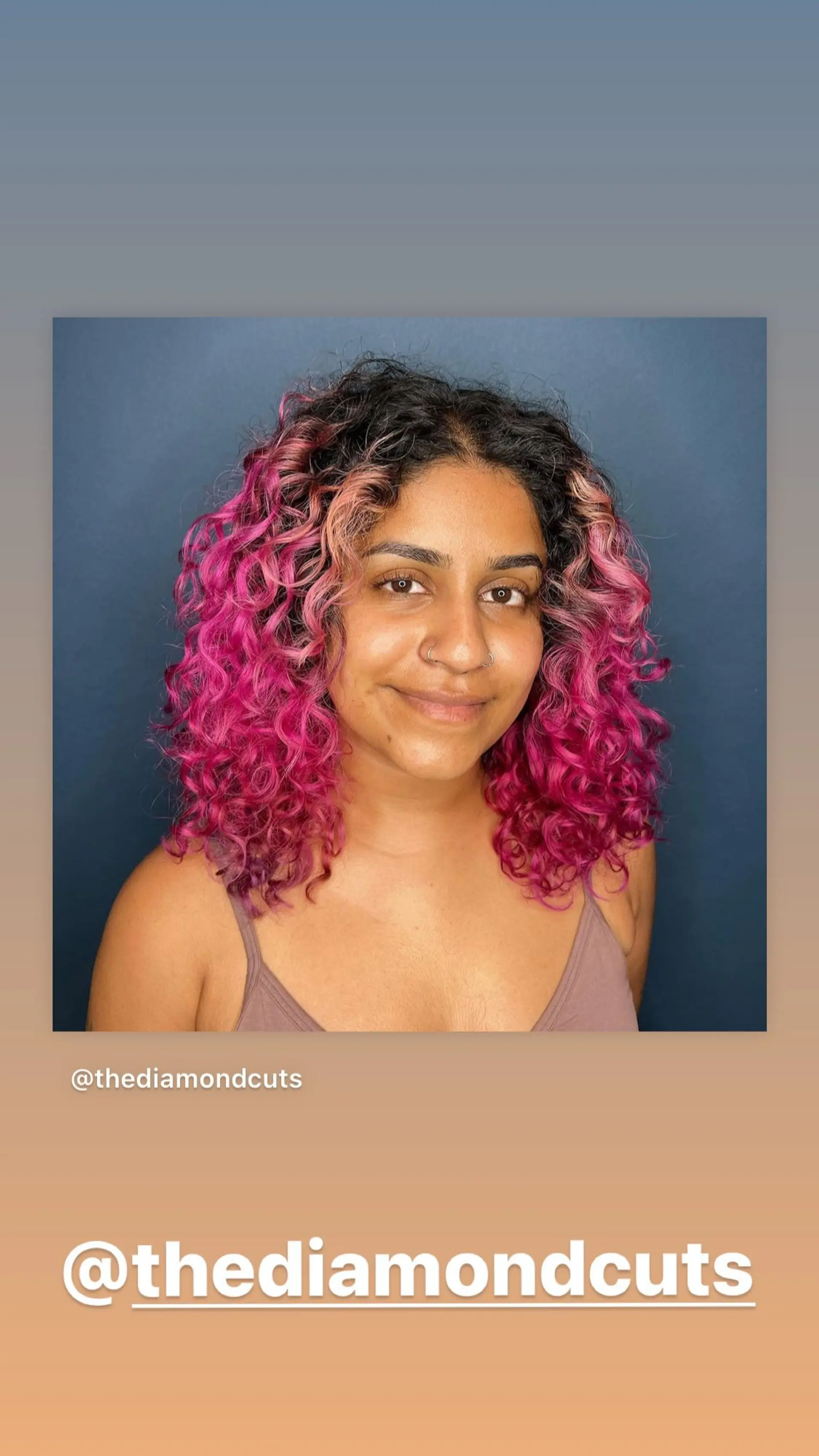 This hairstyle is a shoulder-length curly cut with hot pink coloring. 1
