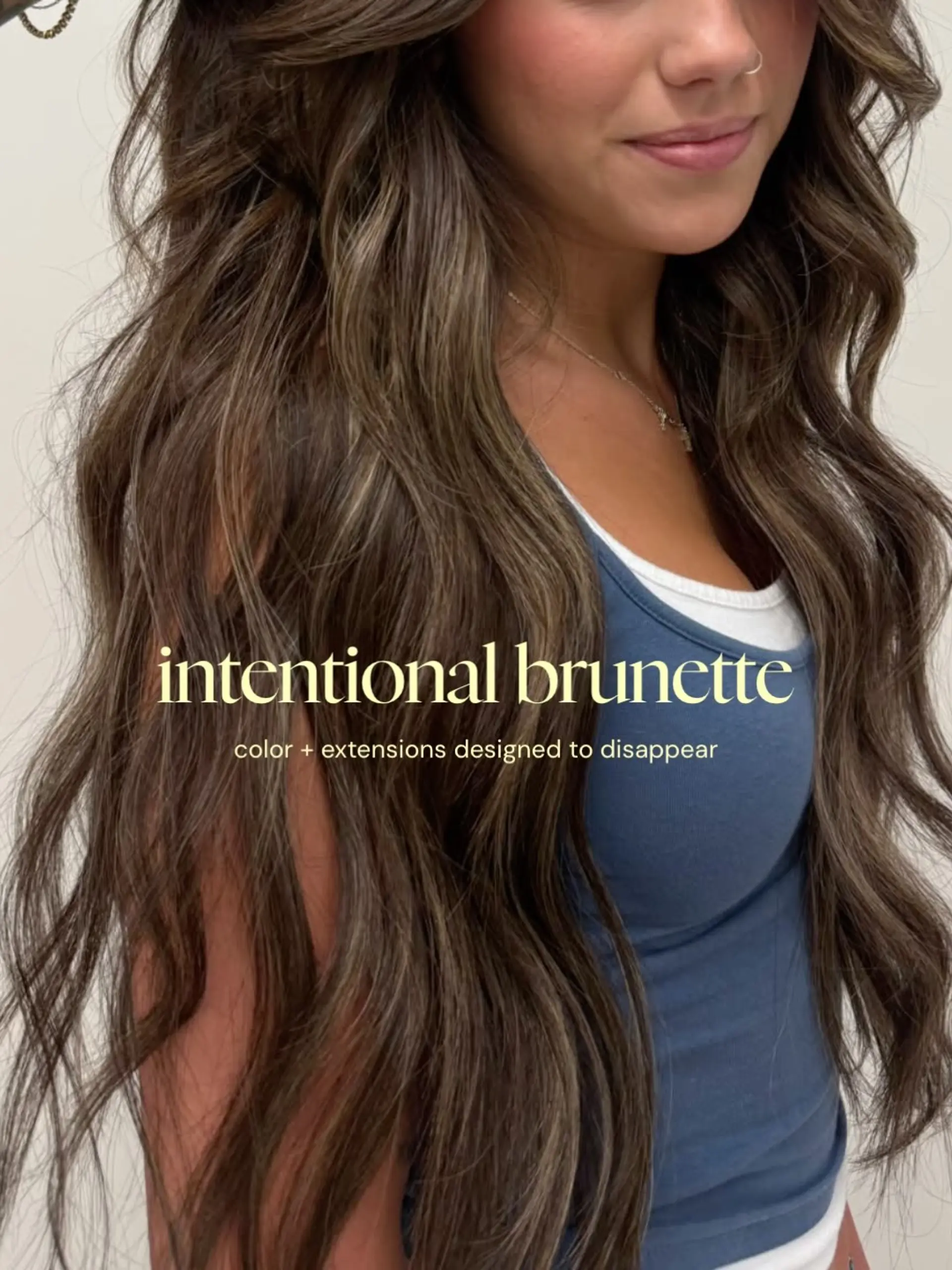 Extra-long dimensional brunette hair styled in loose, textured waves. 1