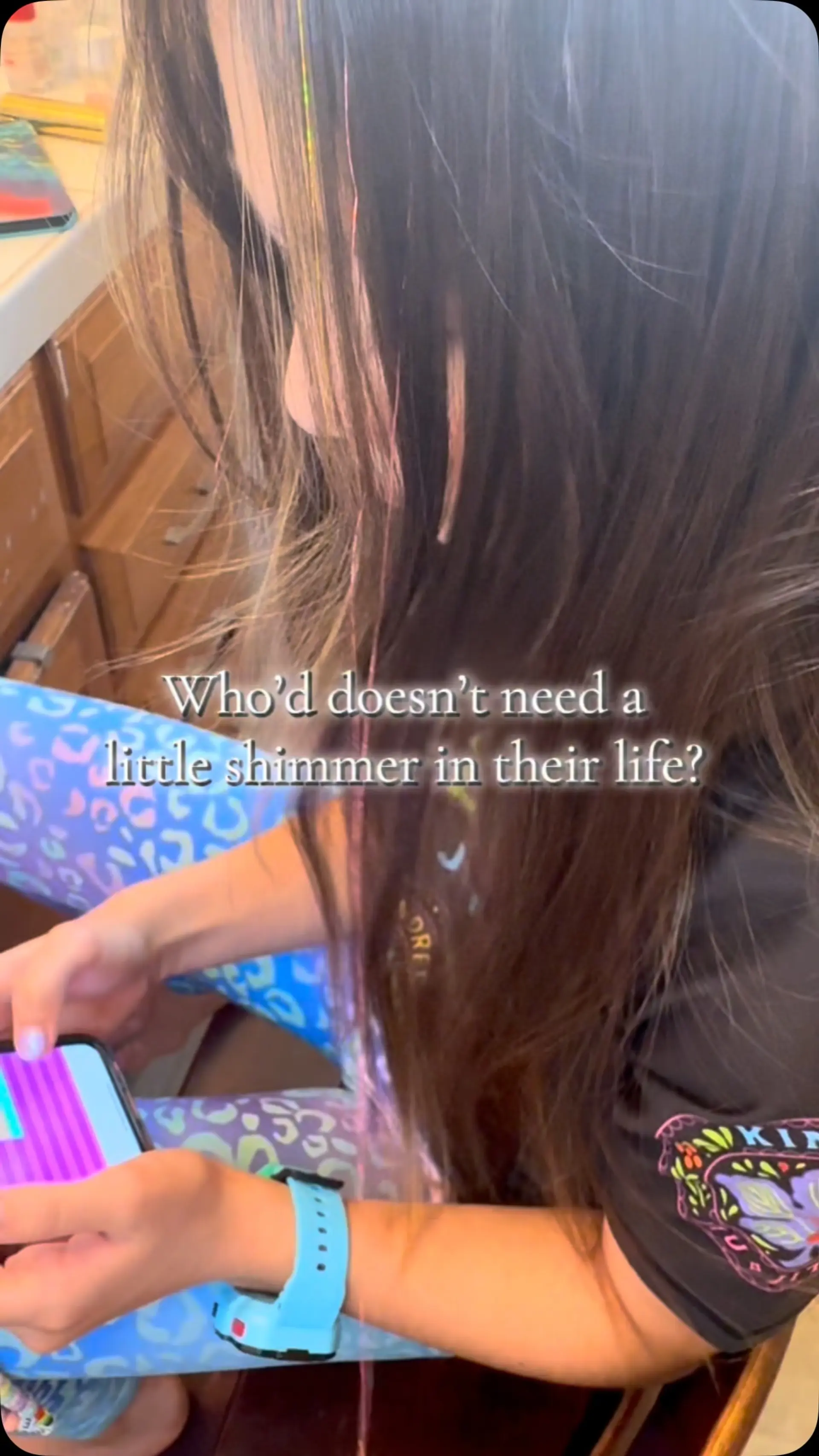 Long straight dark brown hair accented with shimmering iridescent pink hair tinsel strands. 1