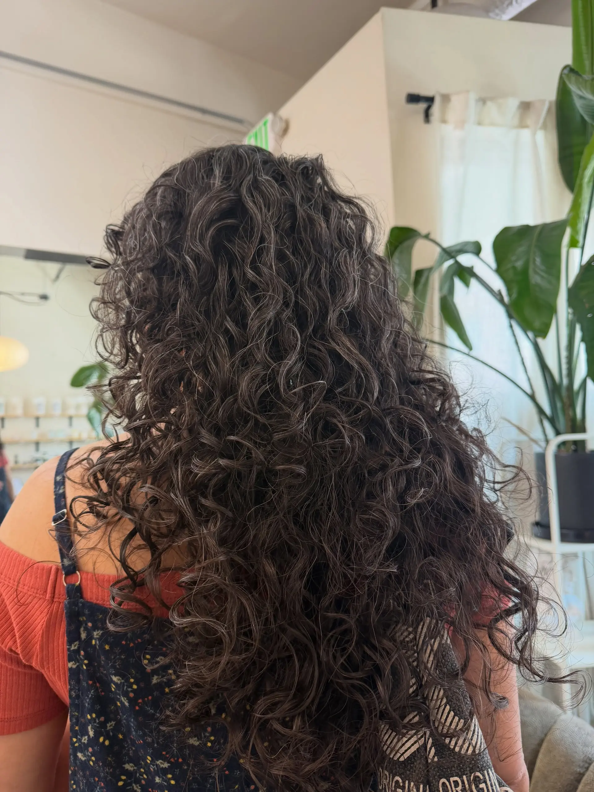 Long, naturally textured curls shaped with layers to maximize definition, bounce, and volume. 1