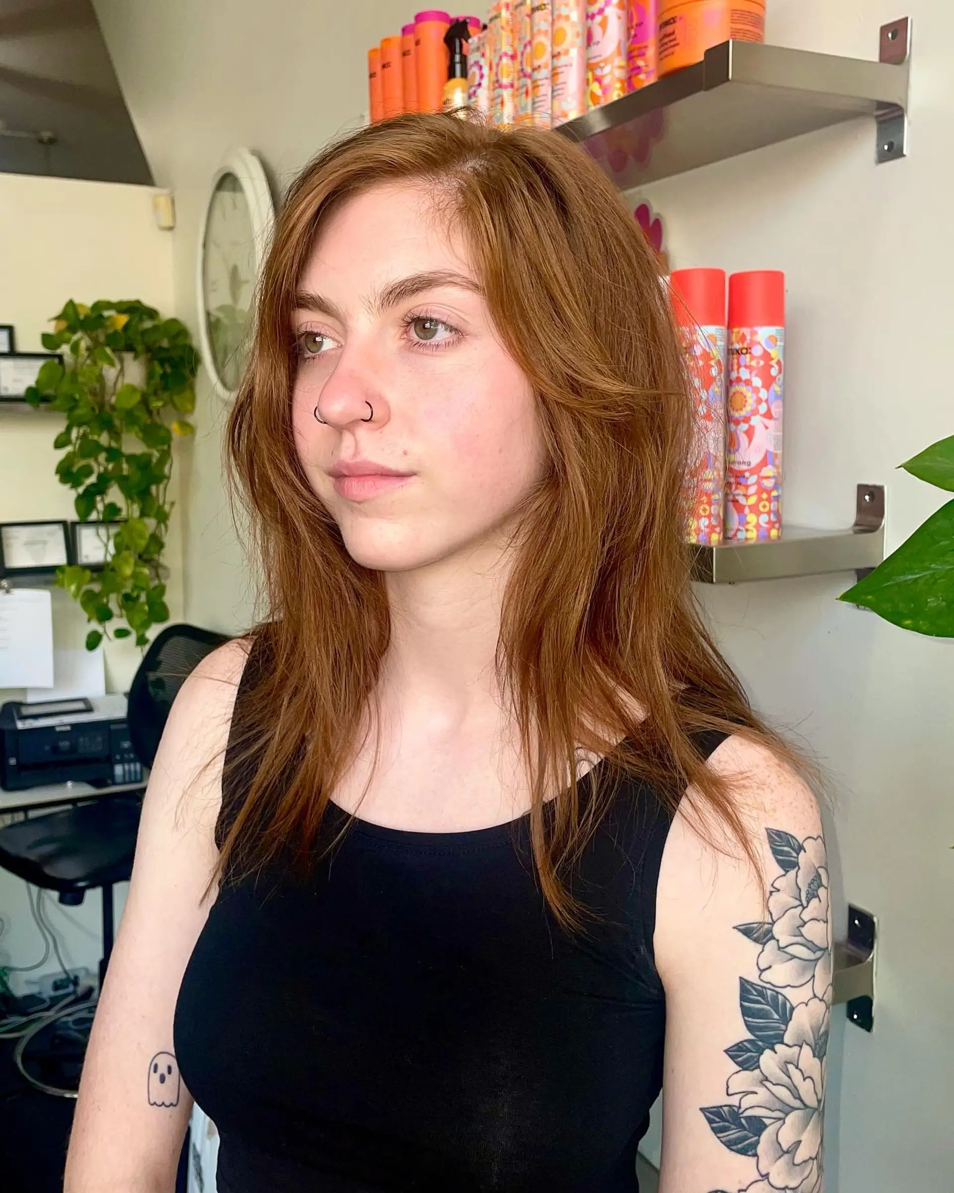 A medium-length shaggy wolf cut with soft face-framing layers and piecey texture in a warm copper tone. 1