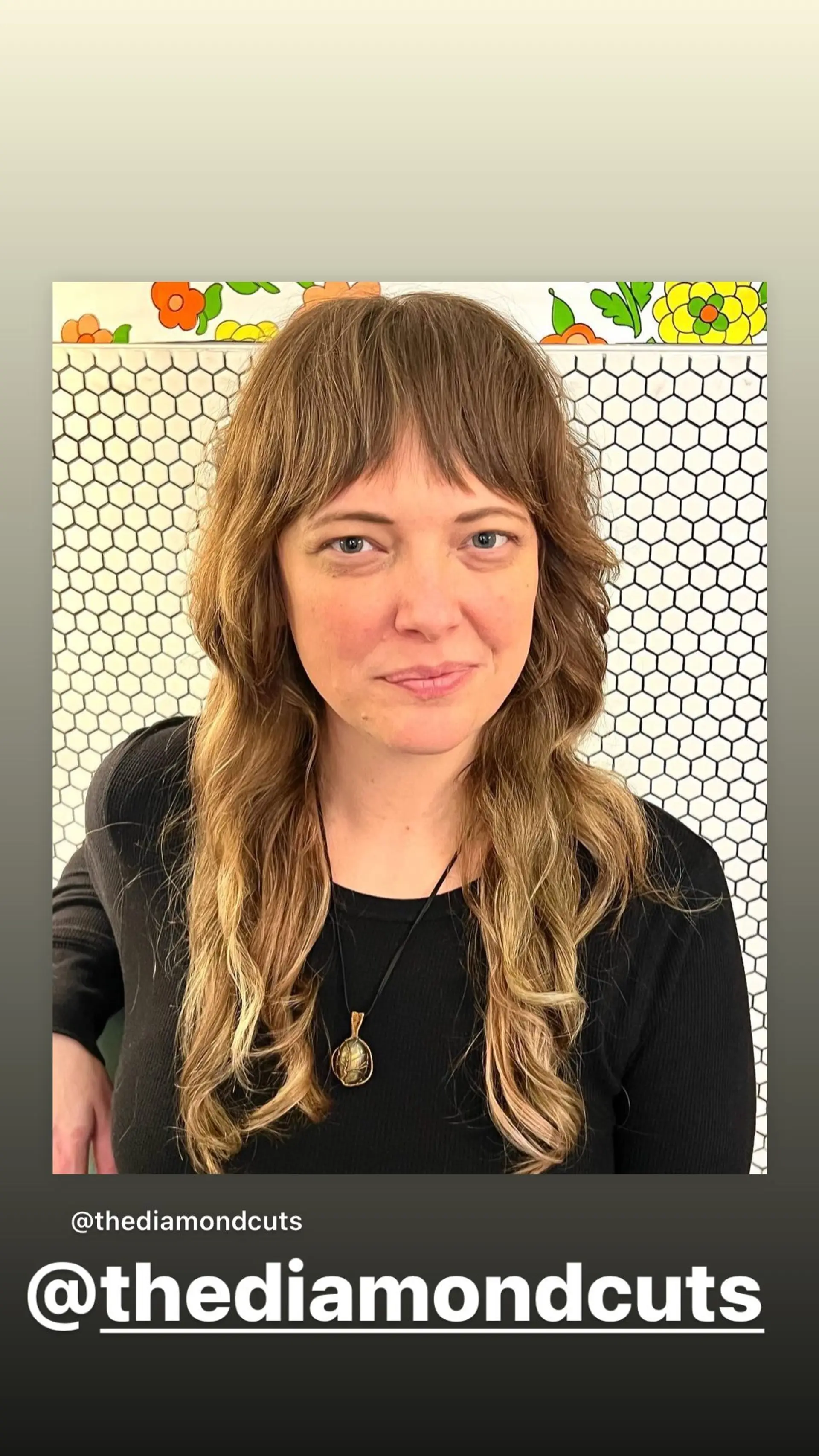 A layered, medium-length shag haircut with soft, face-framing layers and curtain bangs. 1