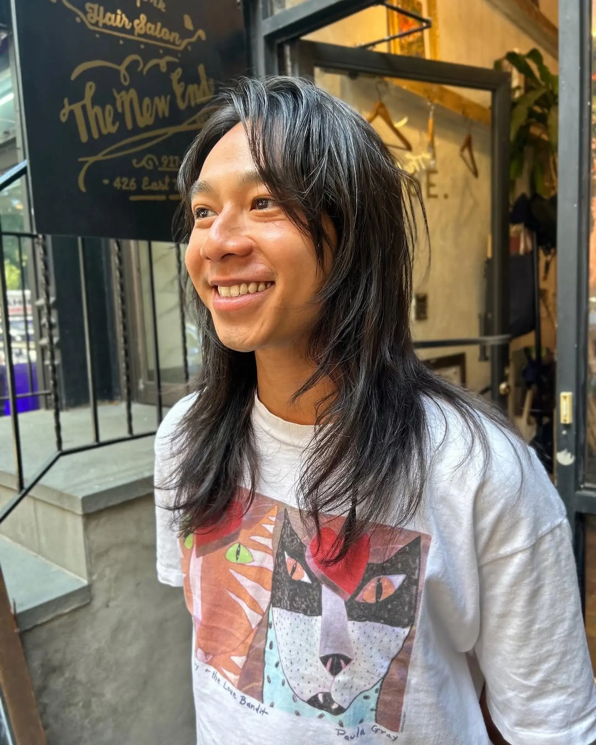 A modern shag haircut with curtain bangs and textured layers. 1