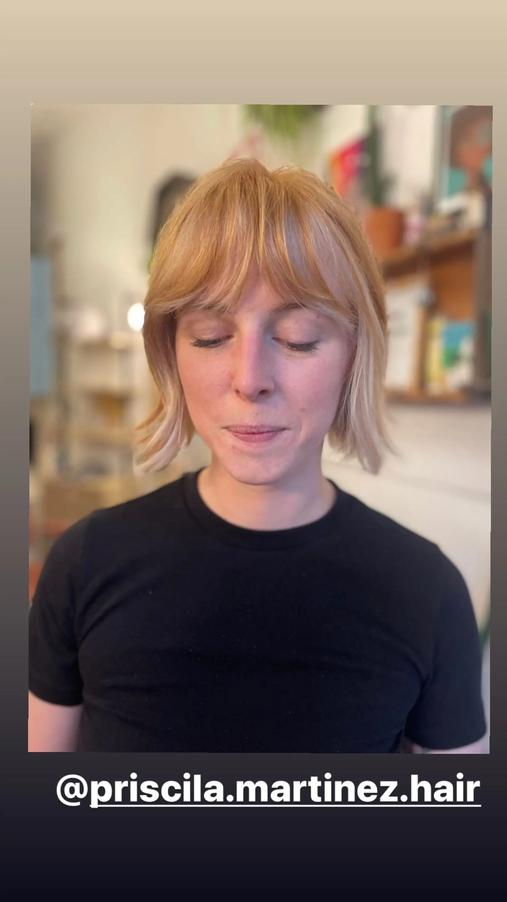 A layered medium-length bob with shaggy texture and full bangs. 1