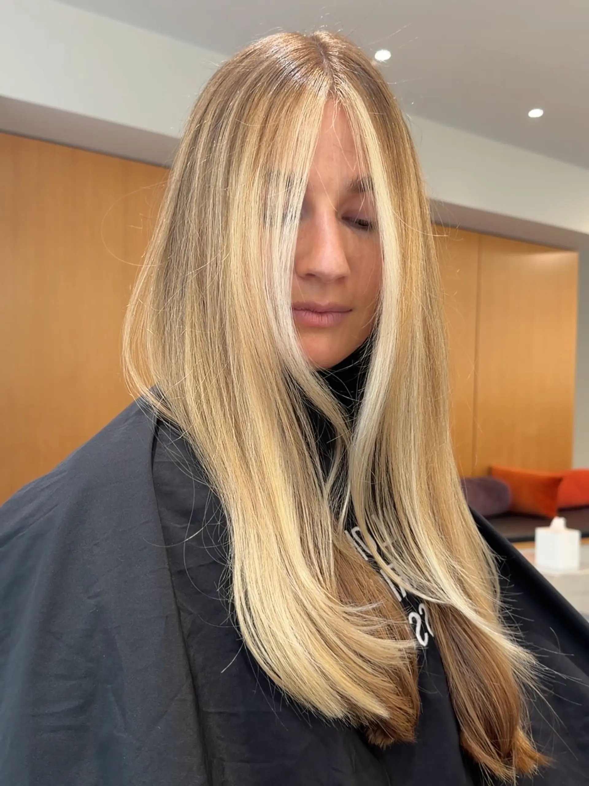 Long straight blonde hair styled with a smooth blowout and bright, high-contrast face-framing money piece highlights. 1