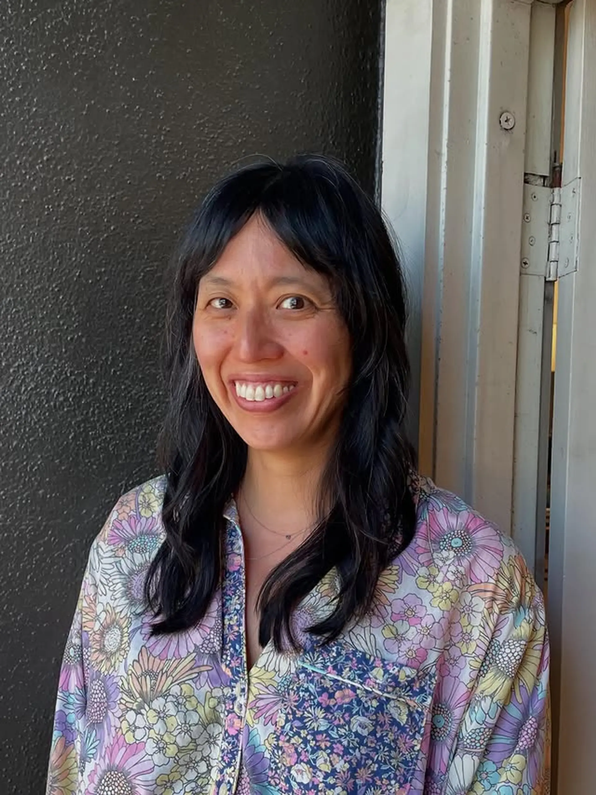 A modern shag haircut with soft layers and face-framing curtain bangs. 1