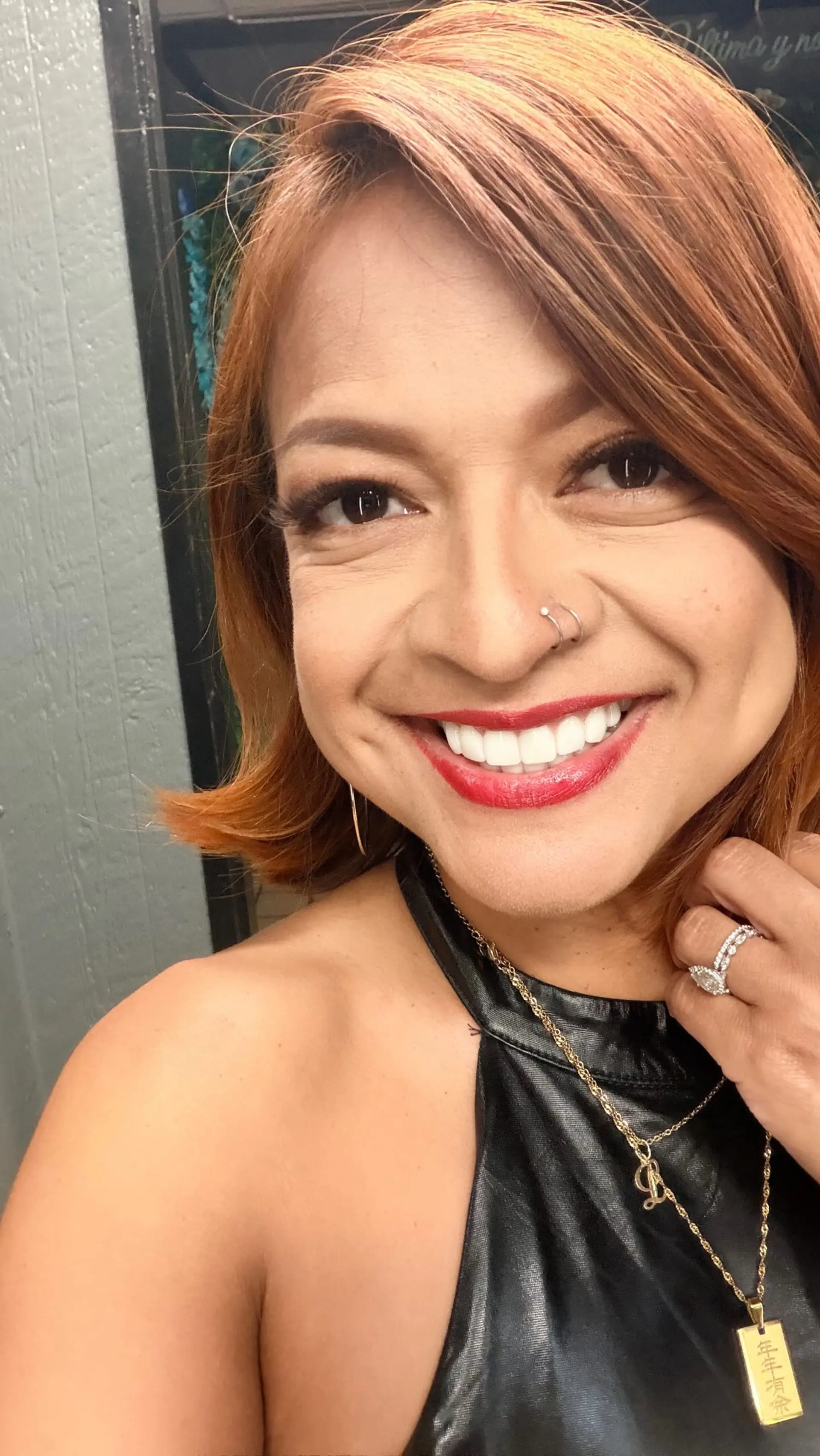 A vibrant fall-inspired copper bob with side-swept bangs and flipped ends. 1