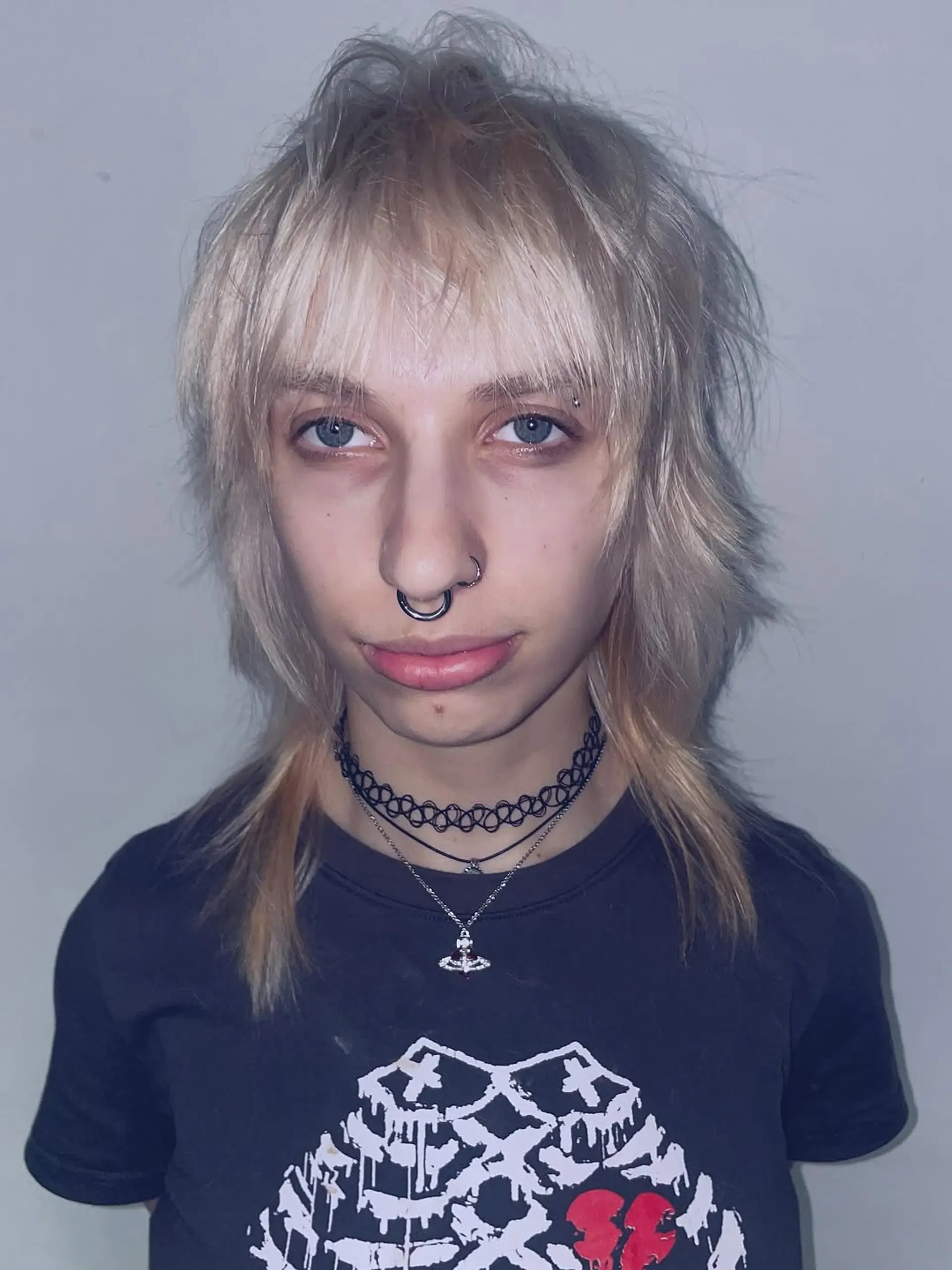 A modern shag-mullet cut with significant texture, shattered layers throughout the crown, and a wispy, length-varied fringe. 1