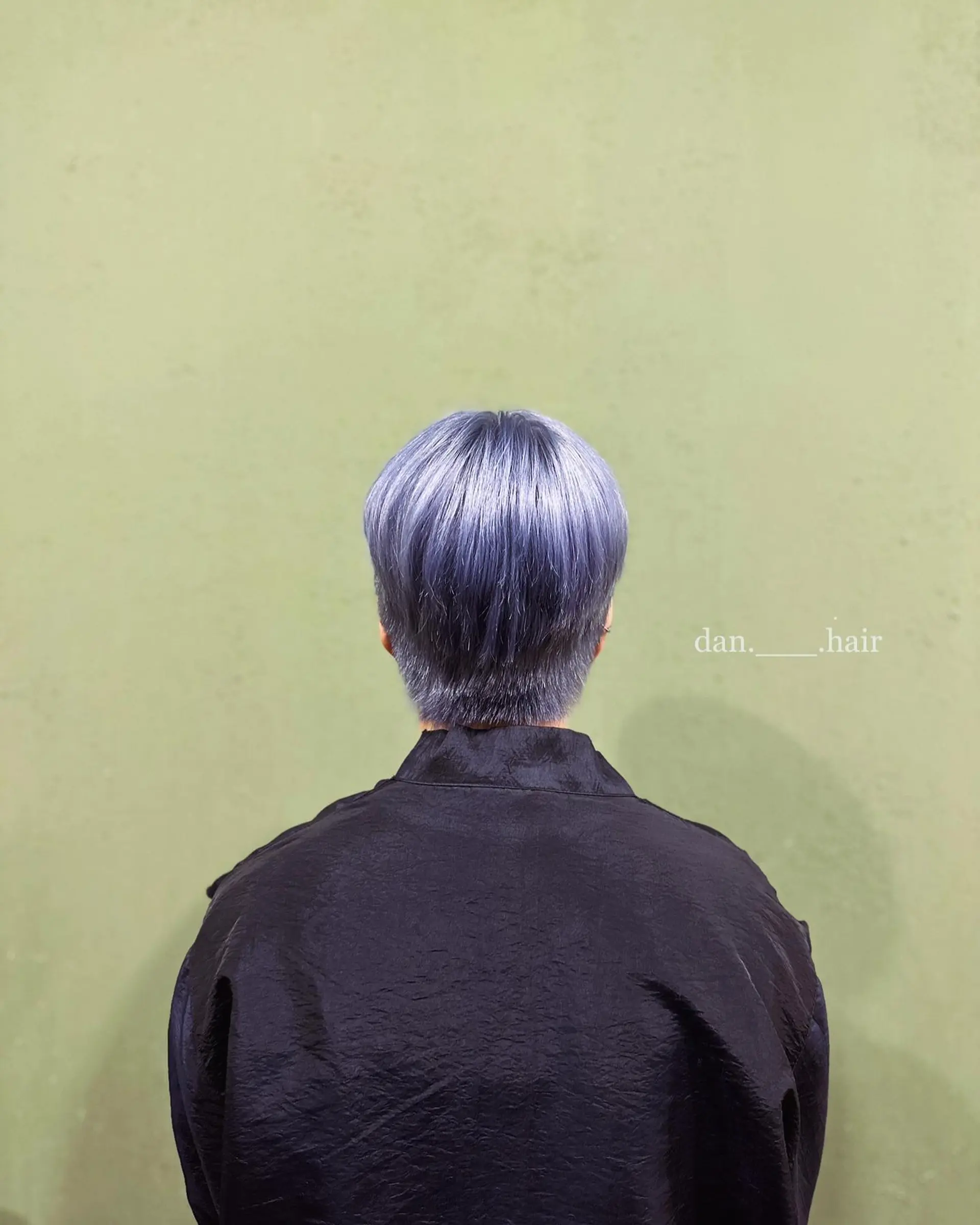 Straight, textured short crop featuring a vibrant, cool-toned ash blue and silver shade with a tapered neckline. 1