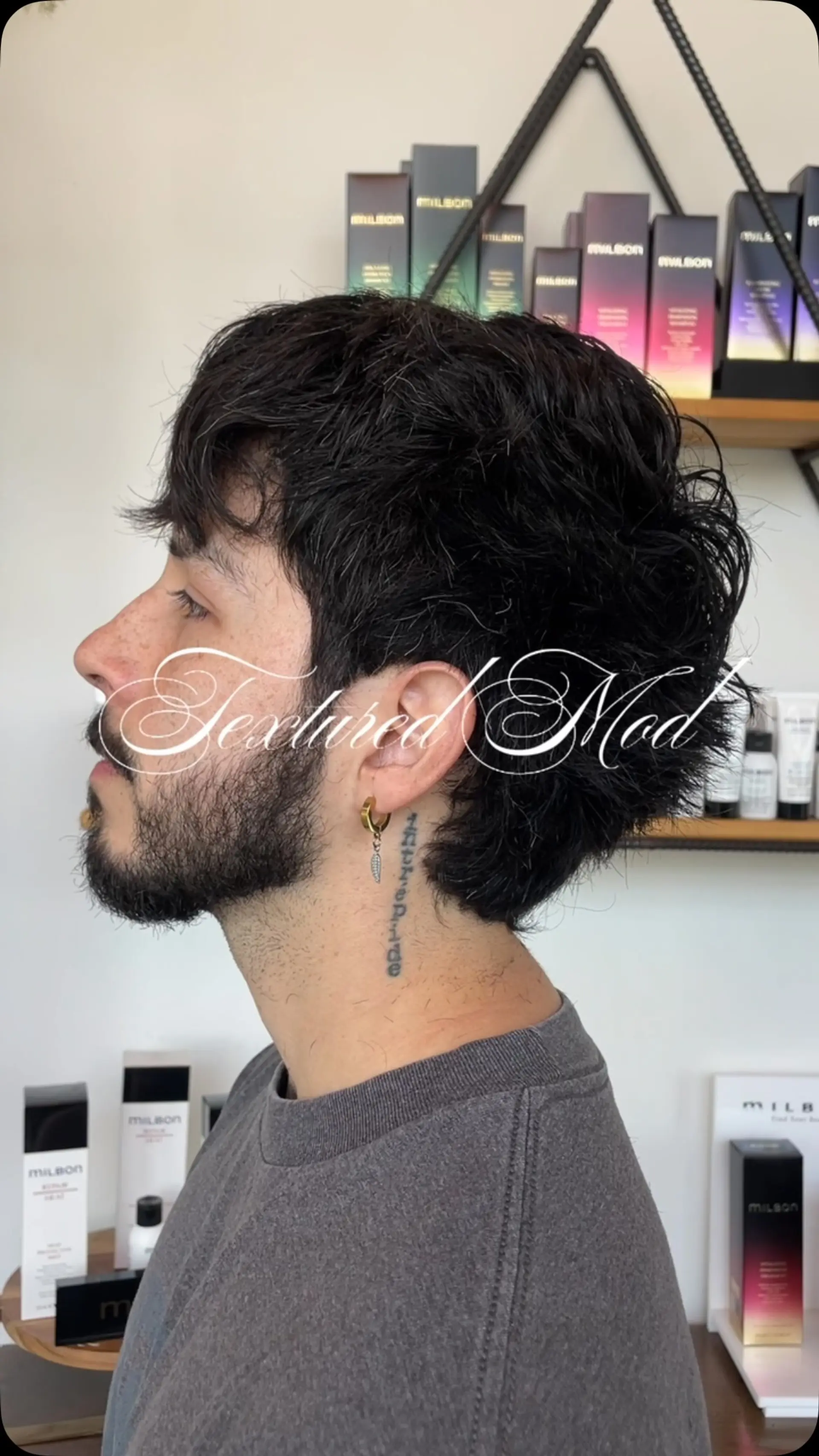 A layered, textured mod haircut with natural wavy movement, voluminous crown, and soft piecey texture. 1