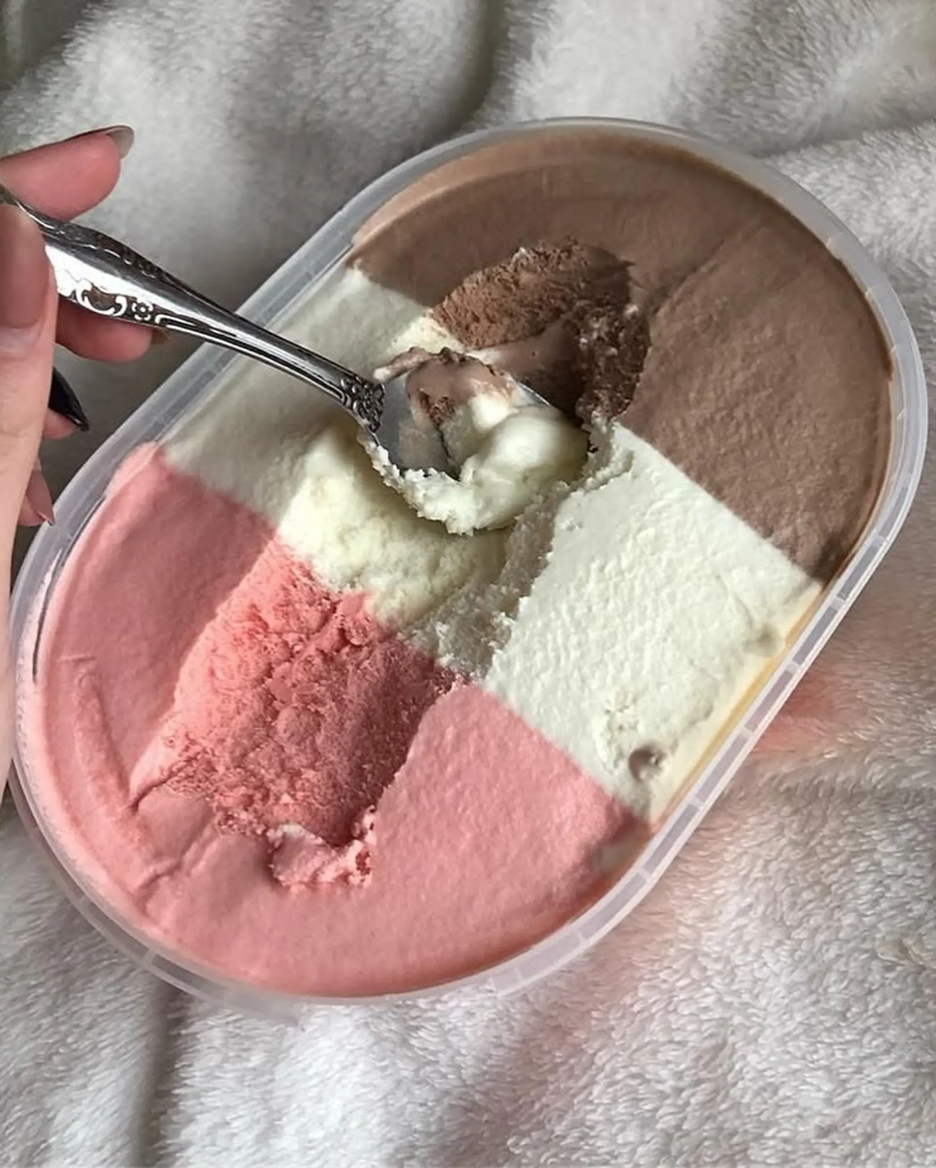 This bold pixie bob features a multi-tonal color block design, incorporating vivid and pastel pinks, light blonde, and a dark brown section for a striking contrast. The cut is layered, ending above the nape, and styled with a blunt fringe. 5