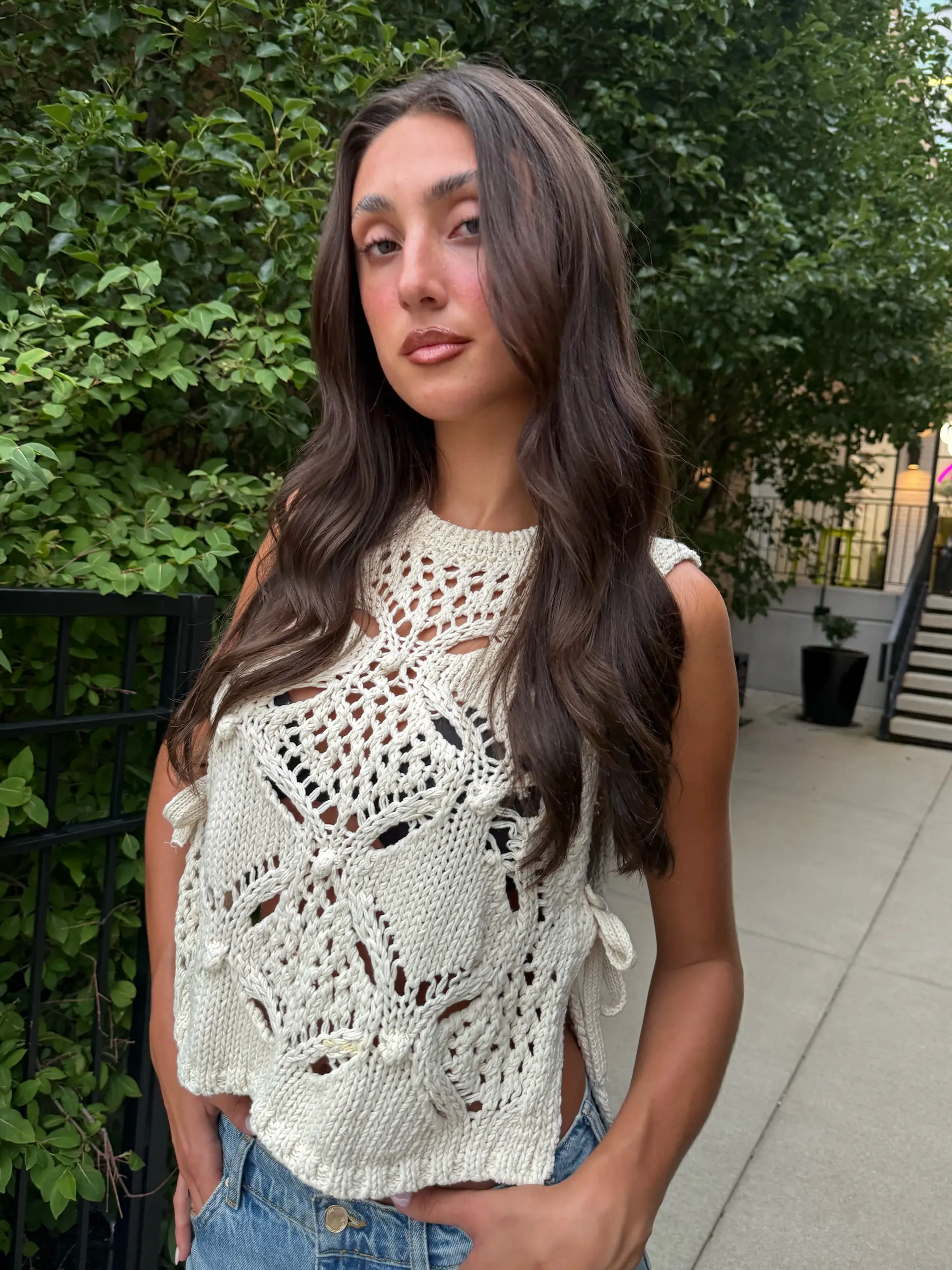 Long dark brown hair styled with soft, face-framing layers and subtle waves. 1