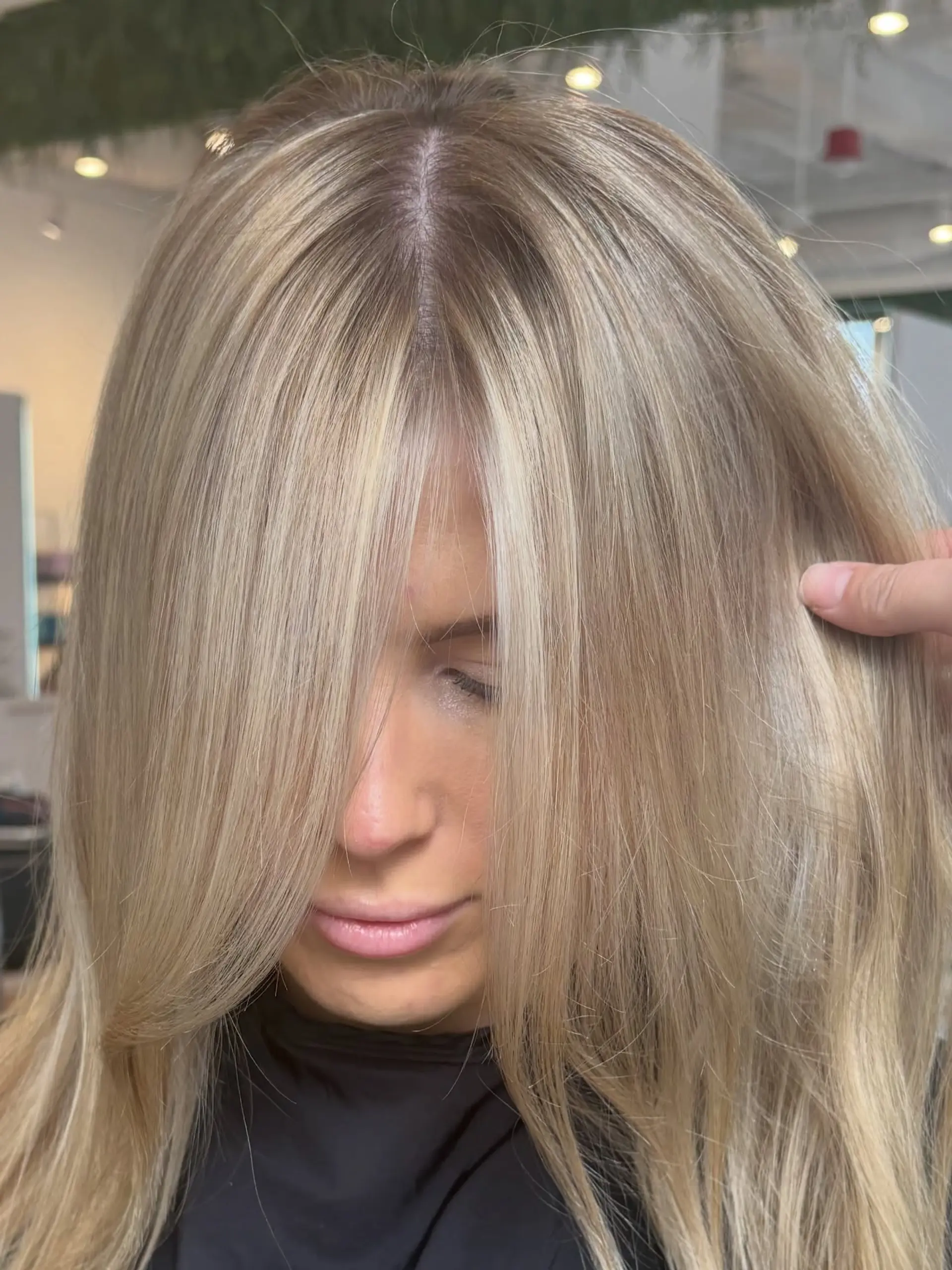 Straight creamy blonde hair with soft face-framing highlights and seamless dimensional blending. 1