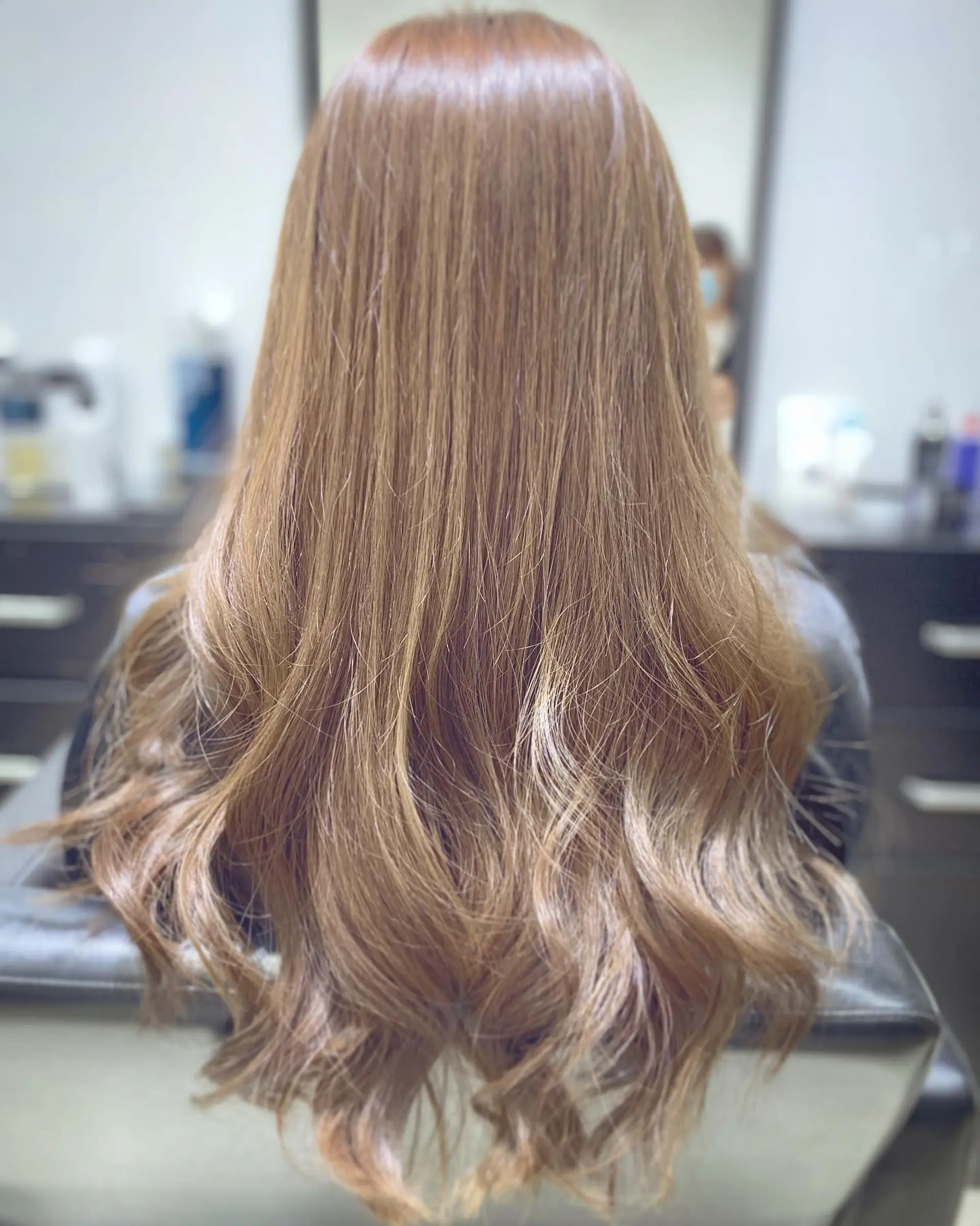 Long, layered hair with soft waves. 1