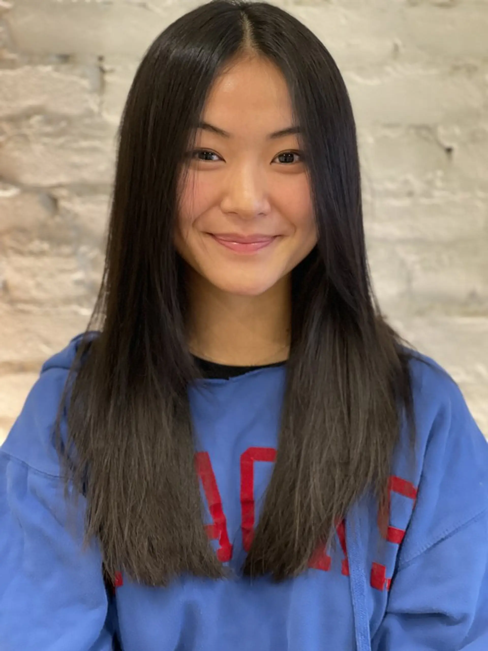A long and sleek straight hairstyle with subtle balayage coloring. 1