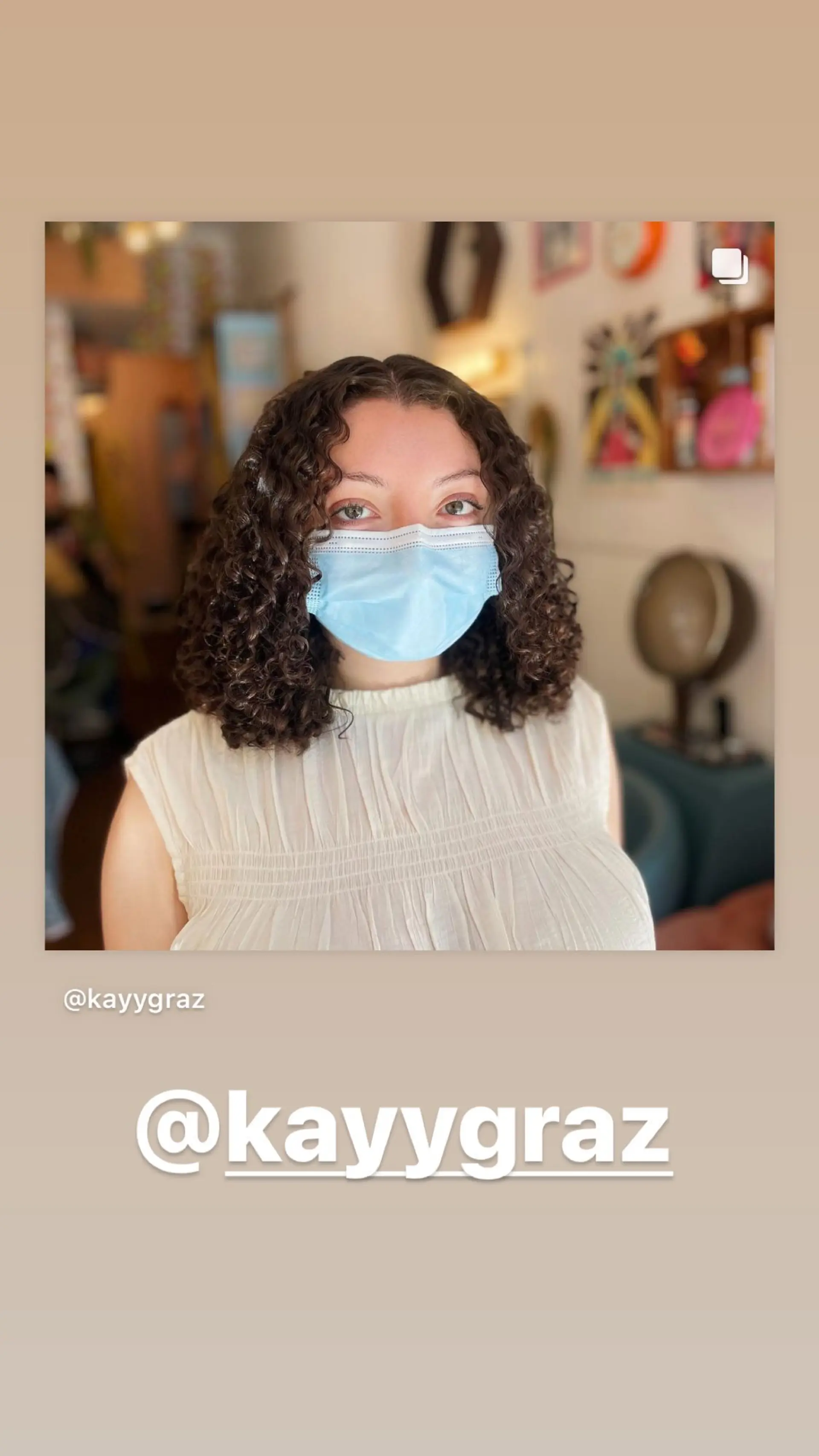 A curly bob with defined curls, creating a voluminous and modern hairstyle. 1