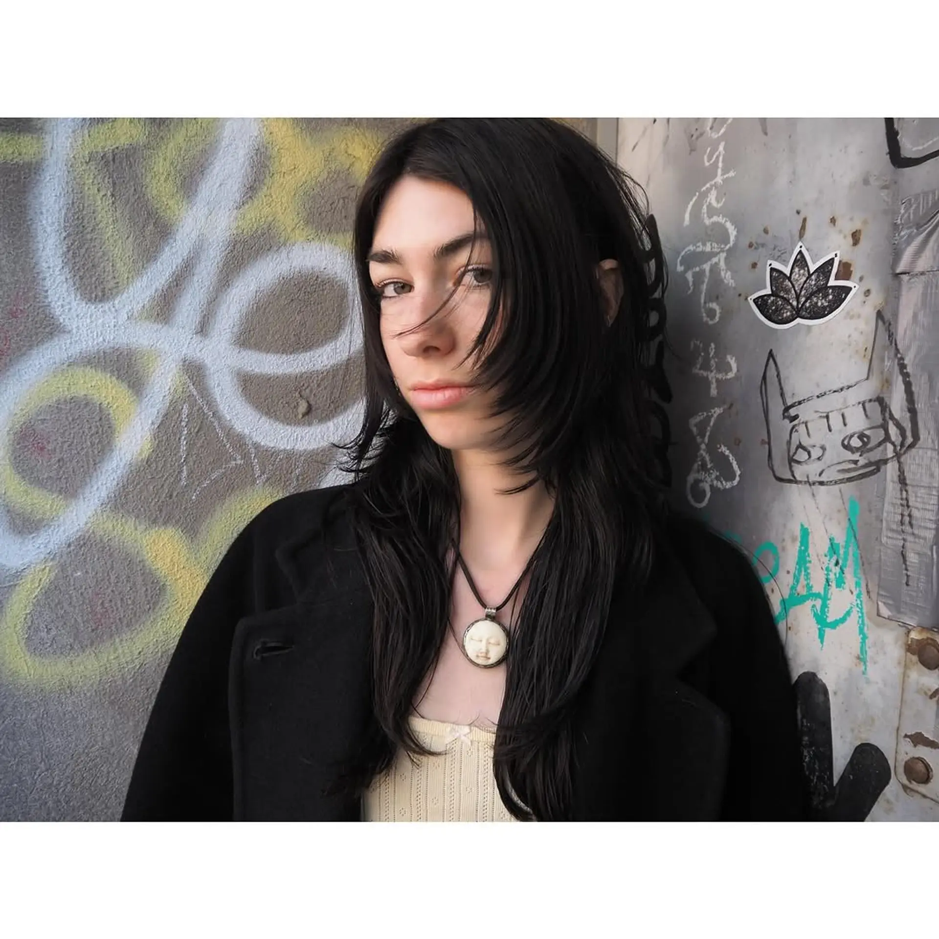 A trendy shag haircut with distinct face-framing layers for a textured and modern appearance. 1