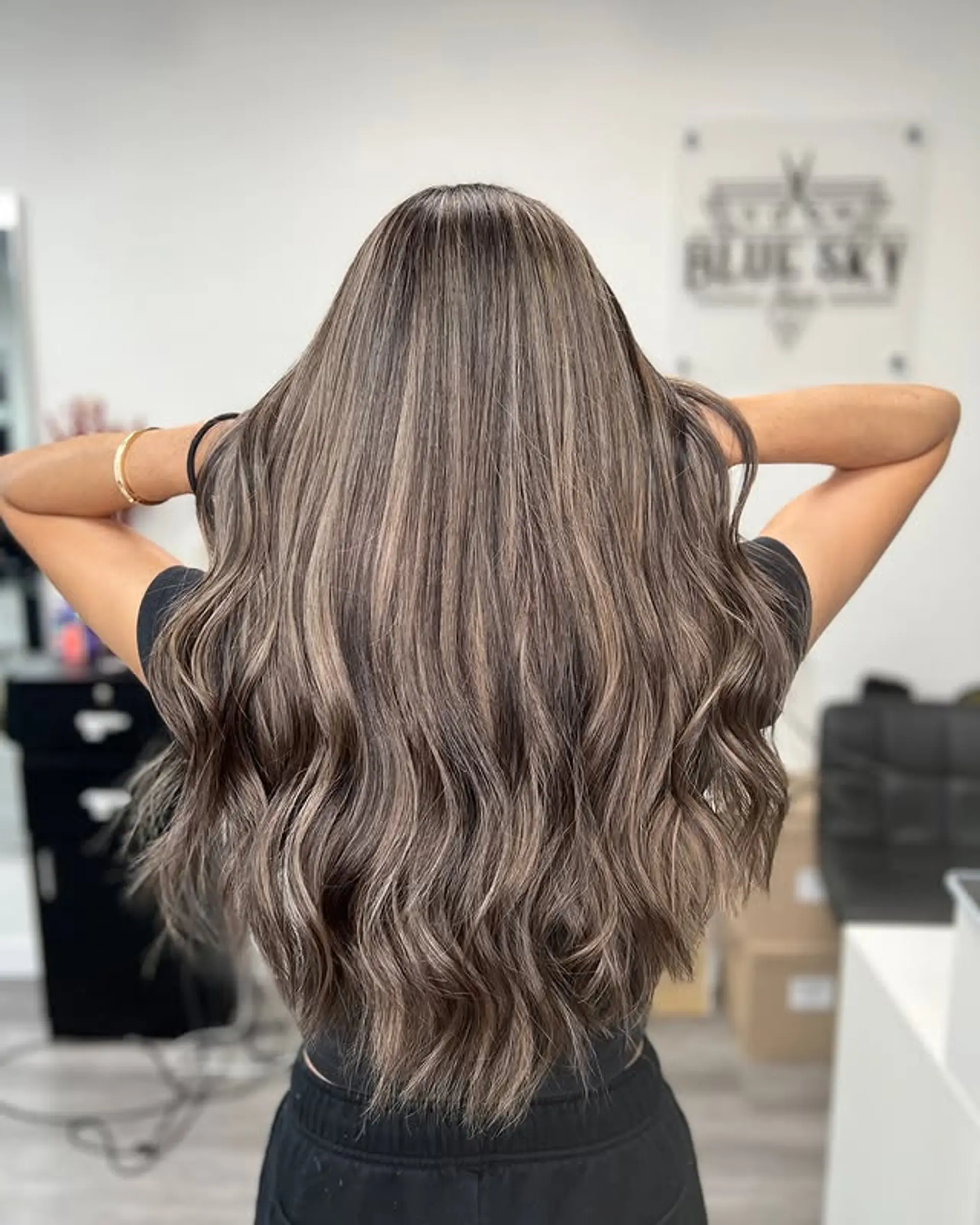 Long wavy hairstyle with a brown and ash blonde balayage. 1