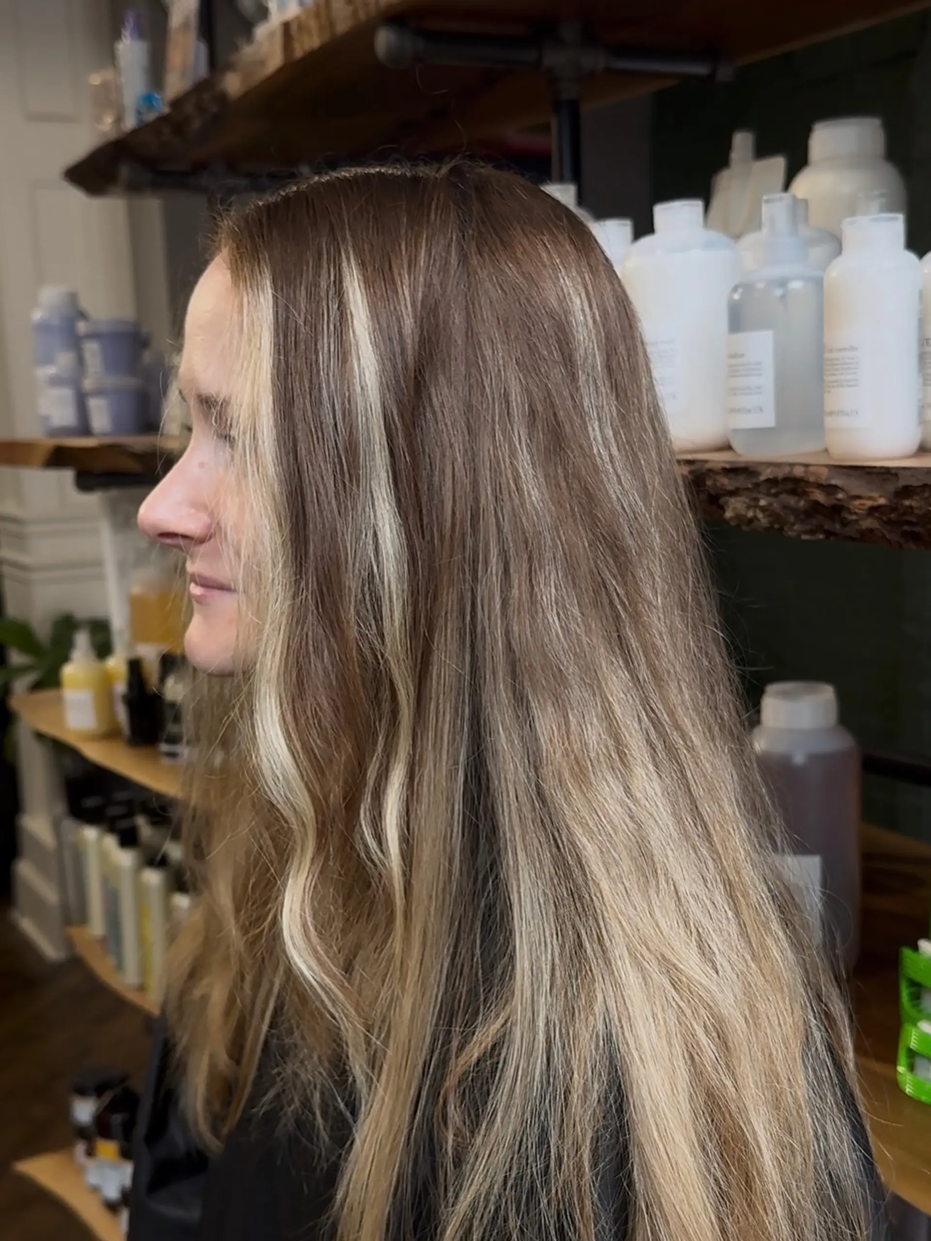 Long light brown hair featuring bright blonde face-framing money pieces and soft dimensional balayage highlights. 1