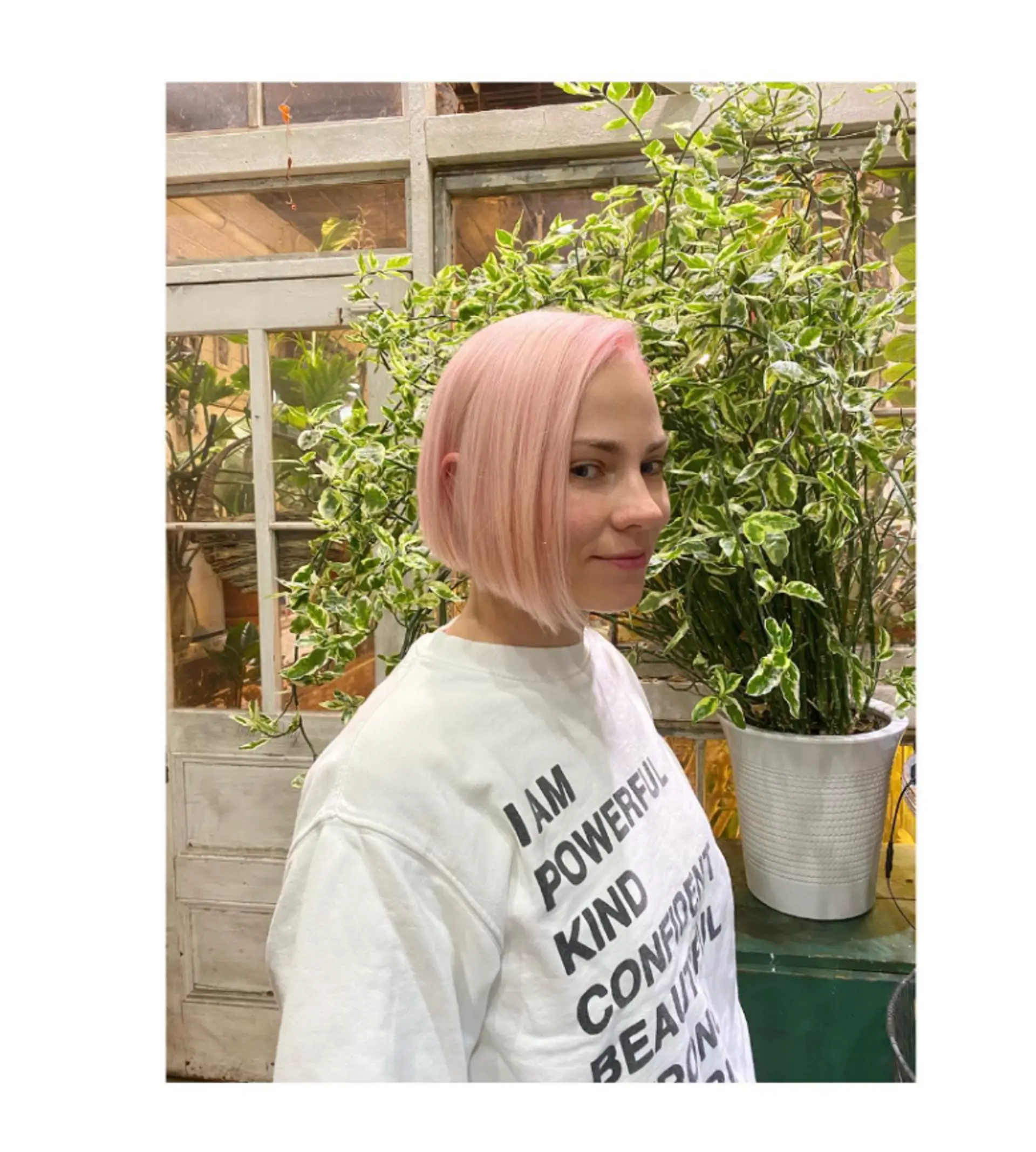 A short, straight bob with a blunt cut and icy pink color. 1