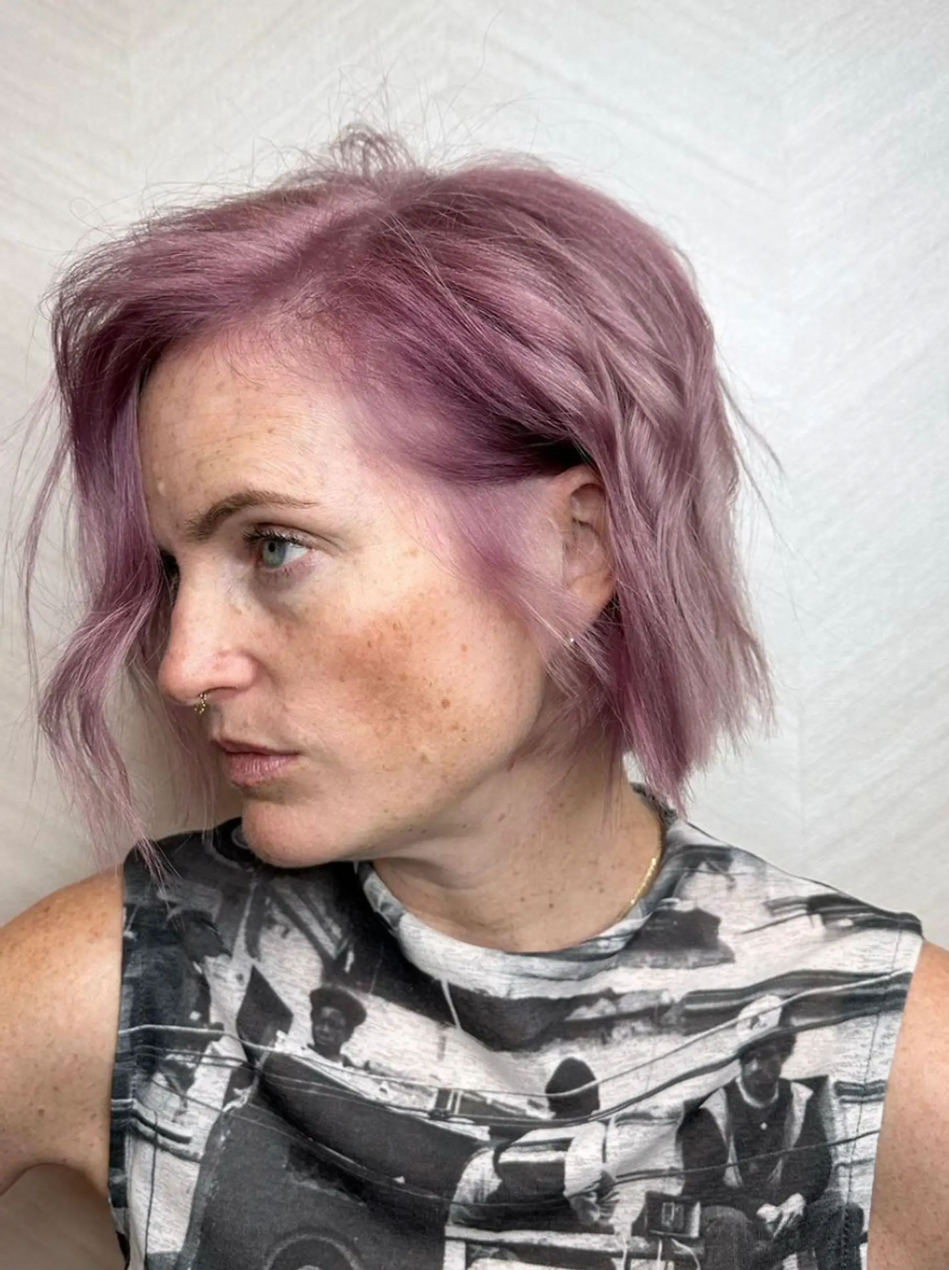A short, textured bob with wavy, pastel lavender and pink hair that adds movement and depth. The overall style is chic and fashion-forward, featuring layers that enhance volume and visual interest.

Color by @simabeautynyc
Cut and style by @juliamannino_hair
 2
