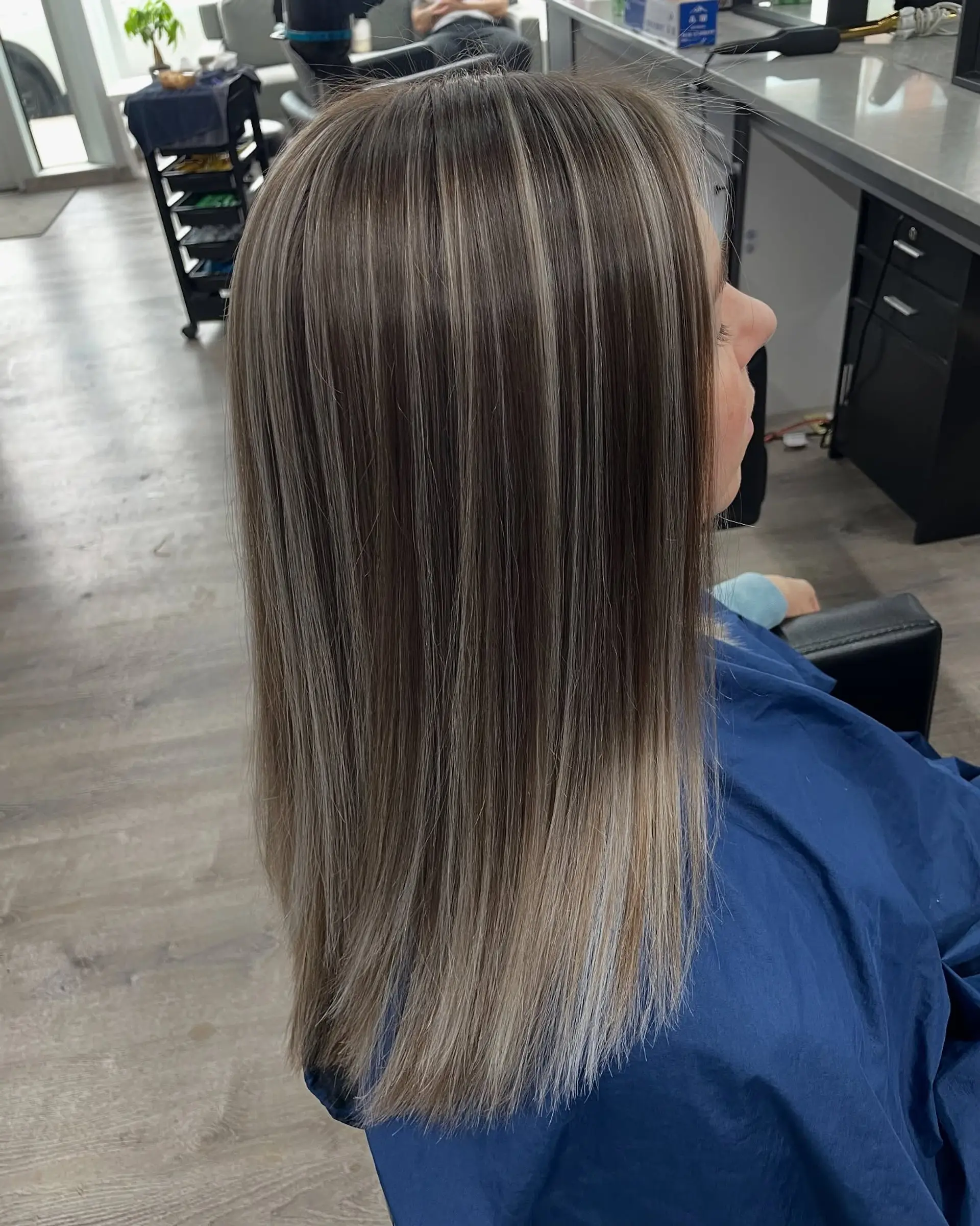 A long, straight bronde balayage hairstyle. 1