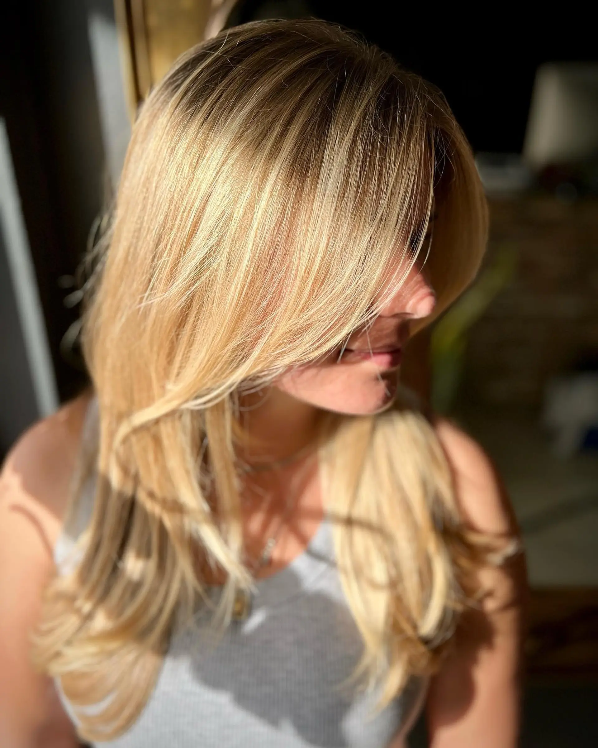 A layered long shag haircut with face-framing curtain bangs. 1