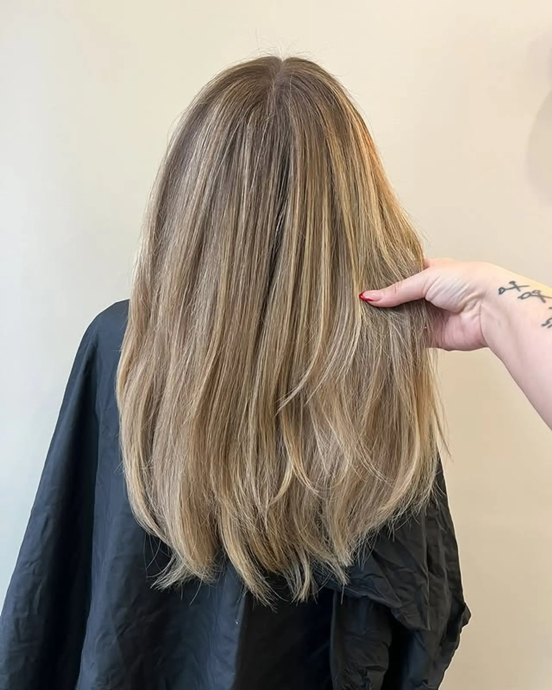Long hairstyle with golden blonde balayage highlights and layers. 1