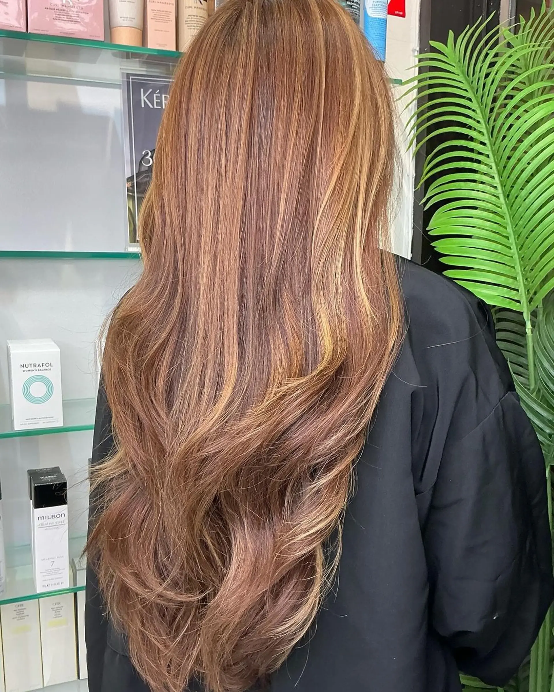 Very long wavy hair featuring bronze, honey blonde, and golden brown hues with a cascading effect. 2