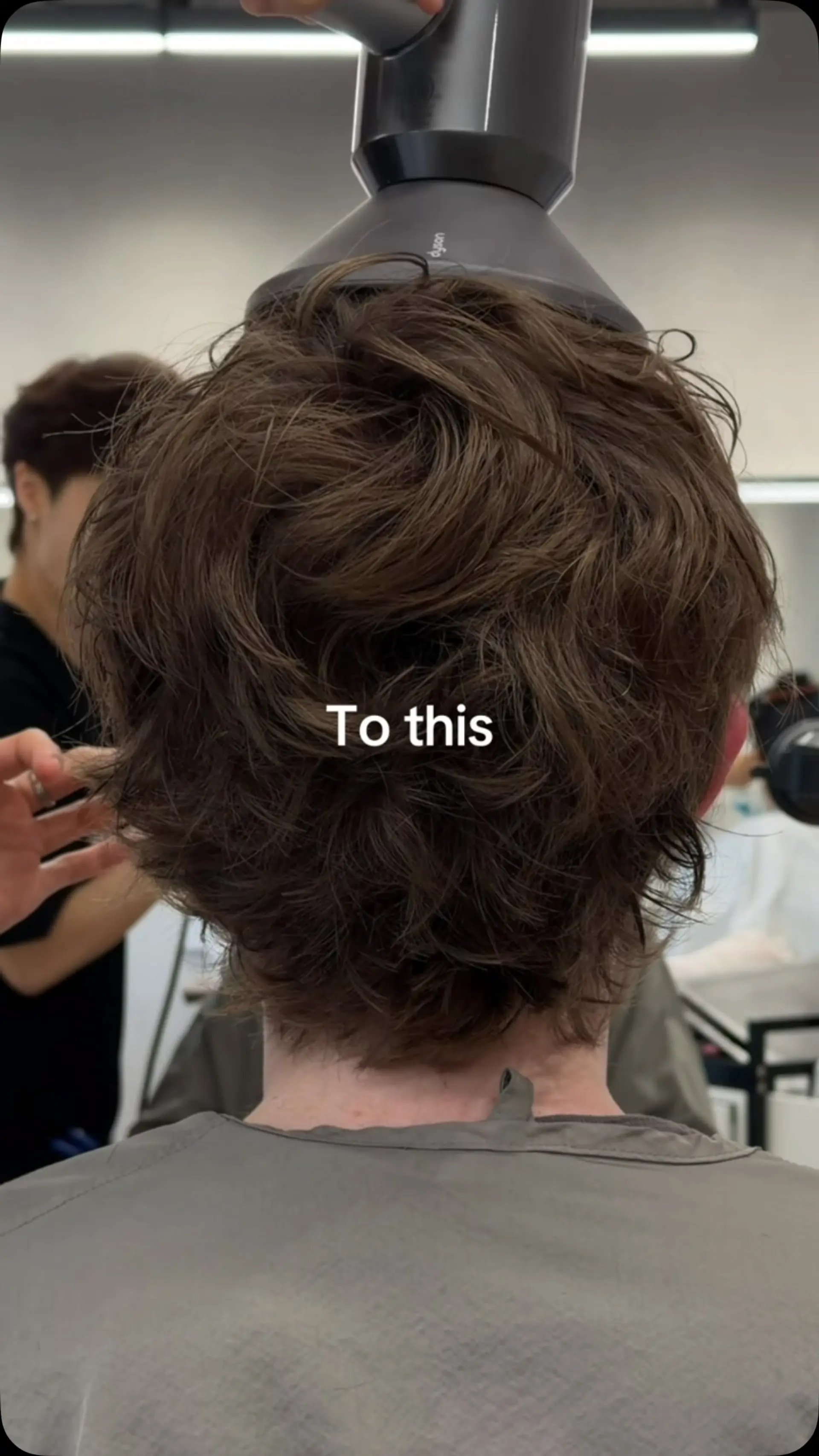 A medium brown, neck-length wavy hairstyle styled with textured, tousled volume using a diffuser. 1