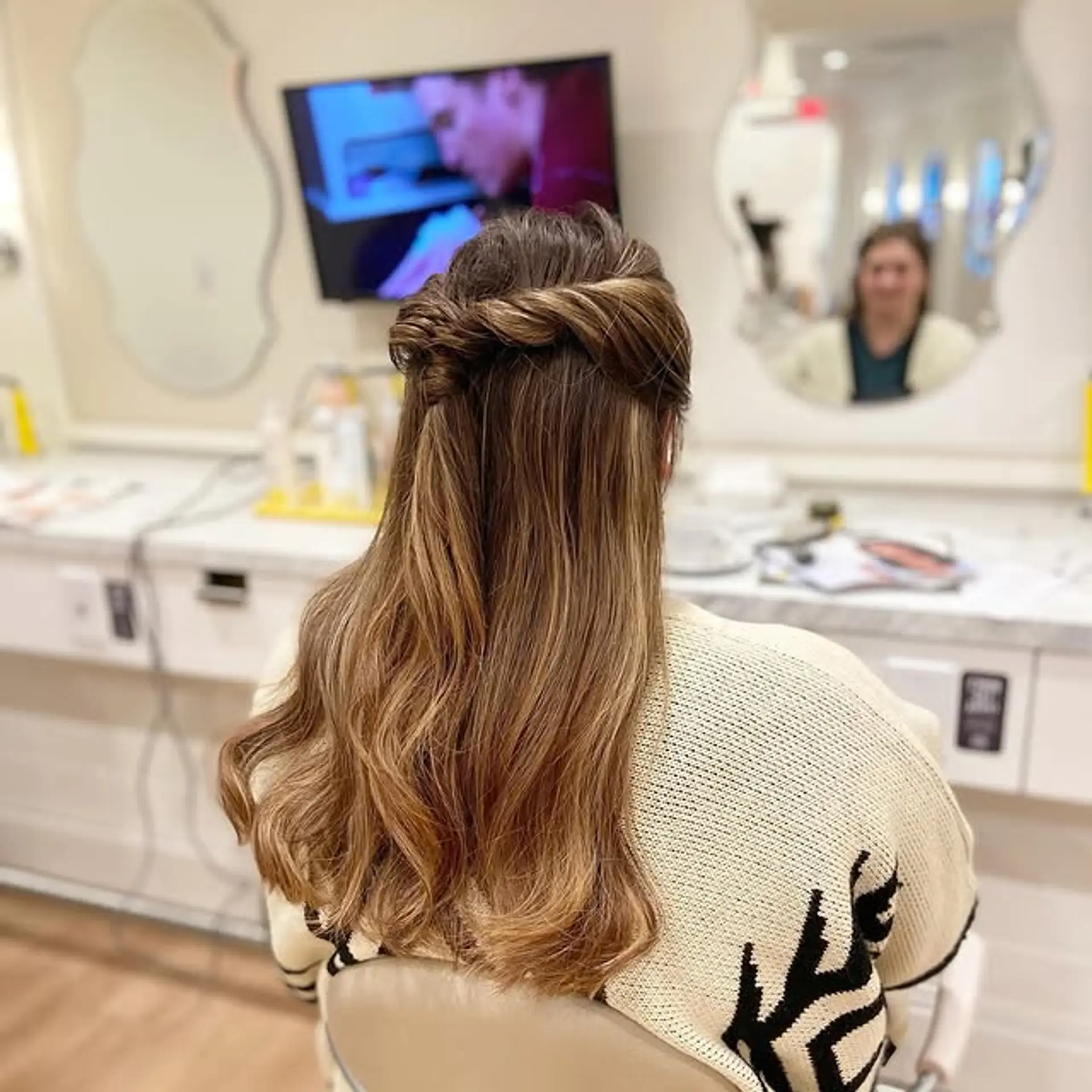 A simple yet elegant half-updo featuring a twisted design to keep hair away from the face, while showing off your hair's length and color. 1