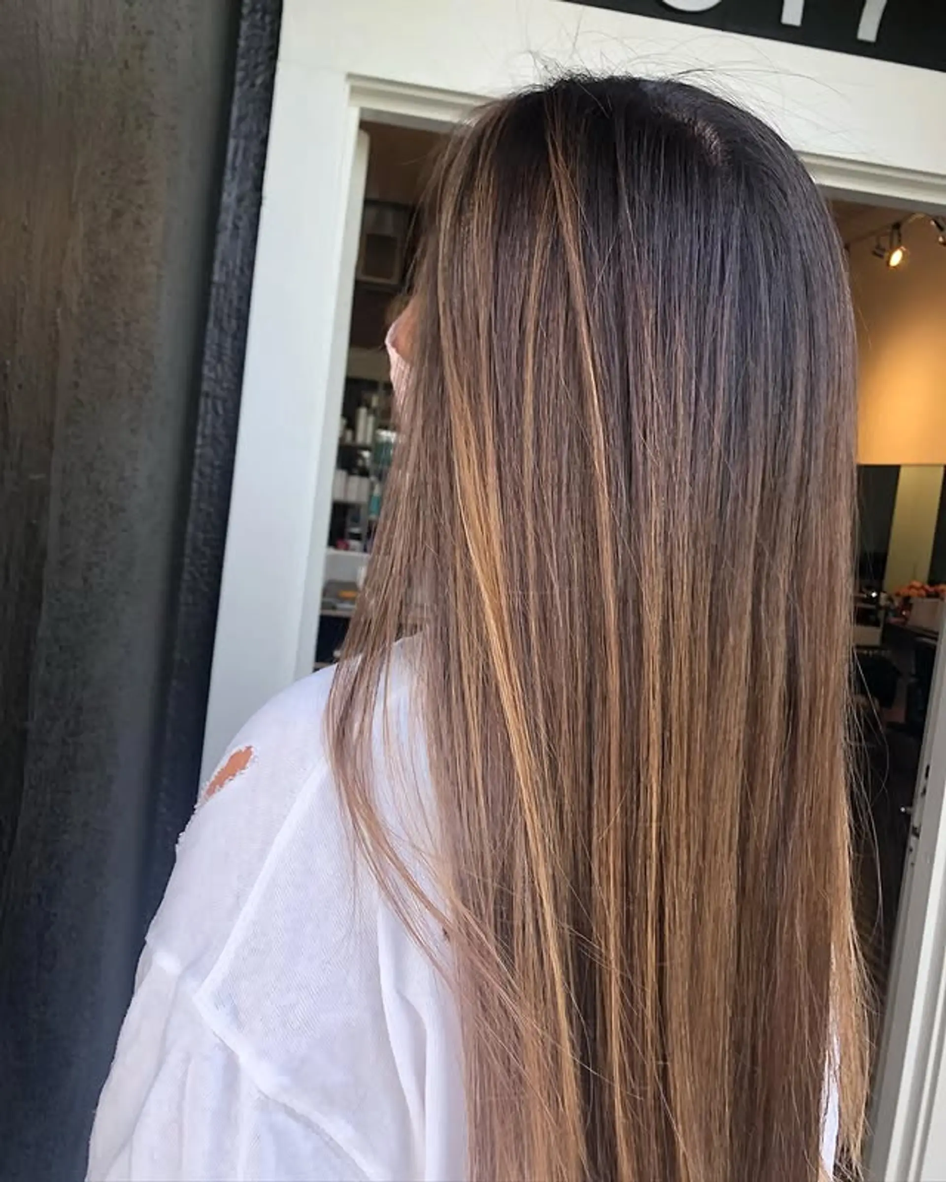 Long, straight hair with a brown and blonde balayage. 1