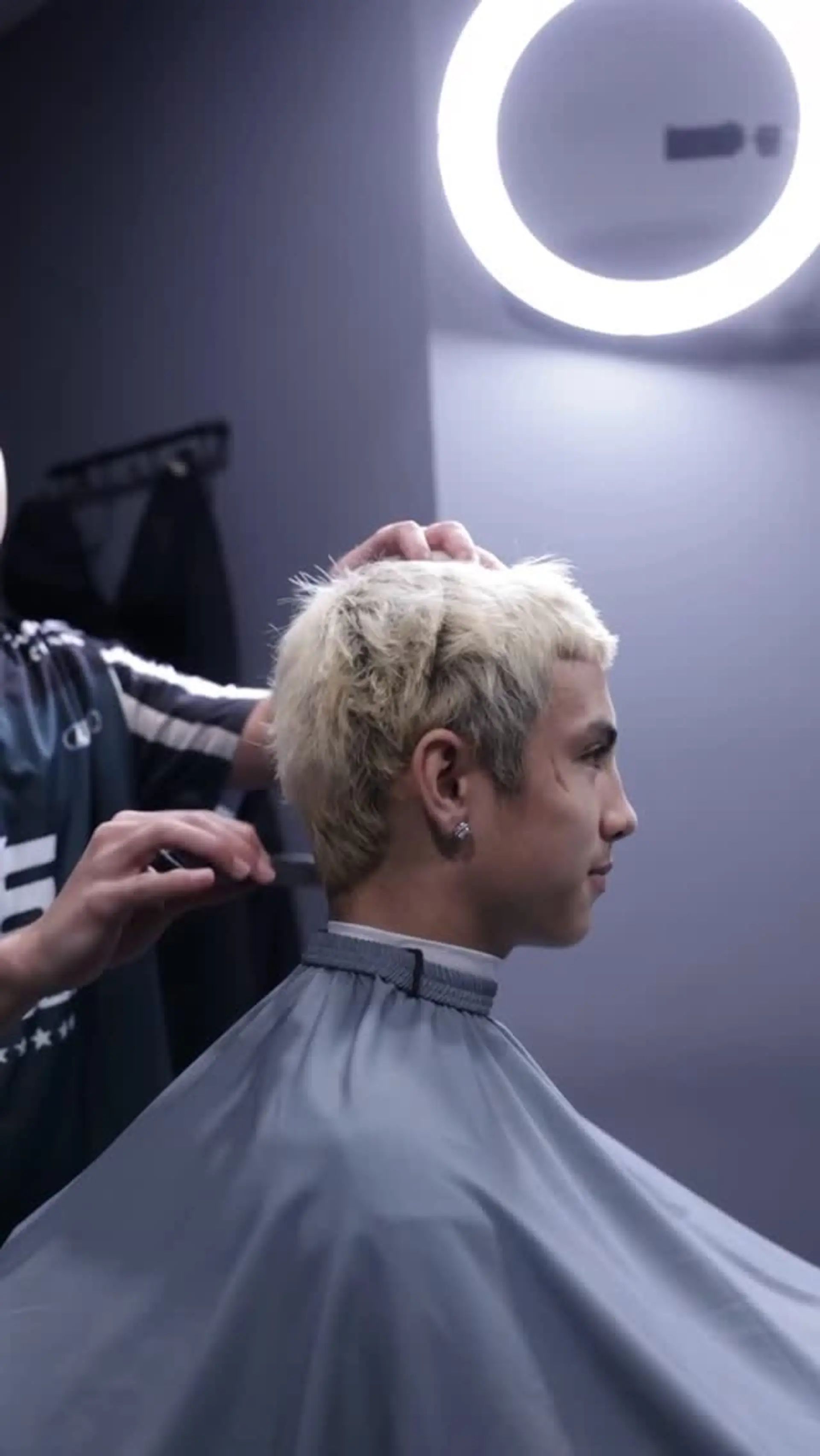 A textured short crop with choppy layering and a blunt mini fringe, finished in a bright bleached blonde tone. 1