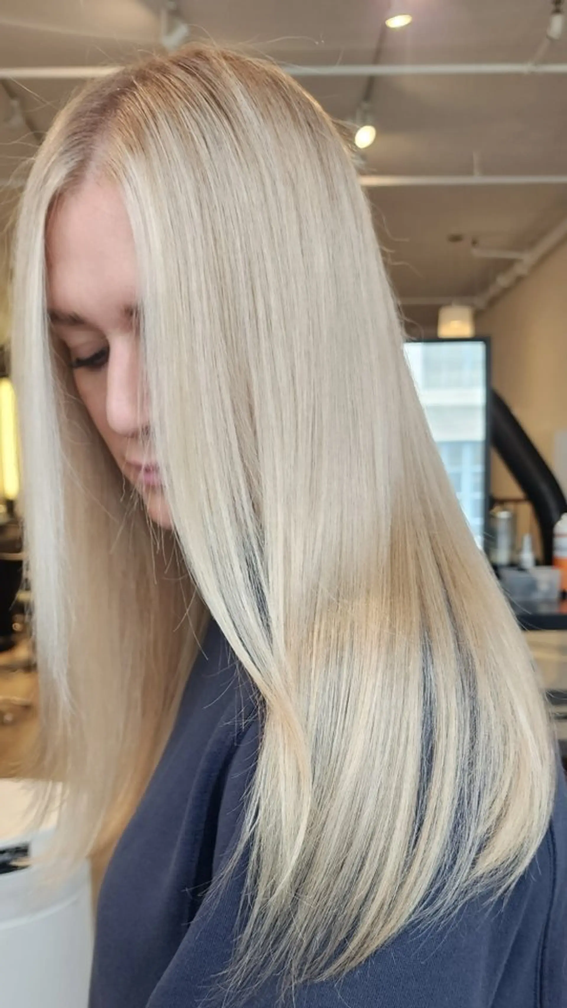 Long, sleek straight blonde hair with bright platinum highlights and a soft natural root. 1