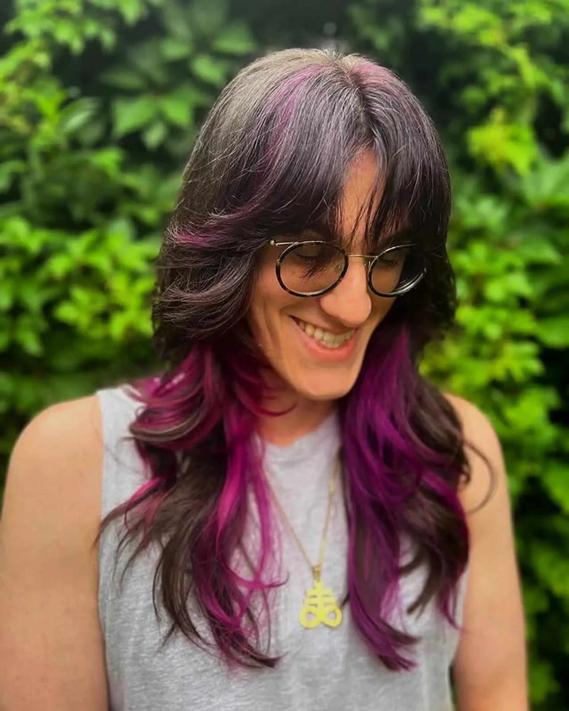 A trendy shag haircut with face-framing layers and vivid color accents. 1