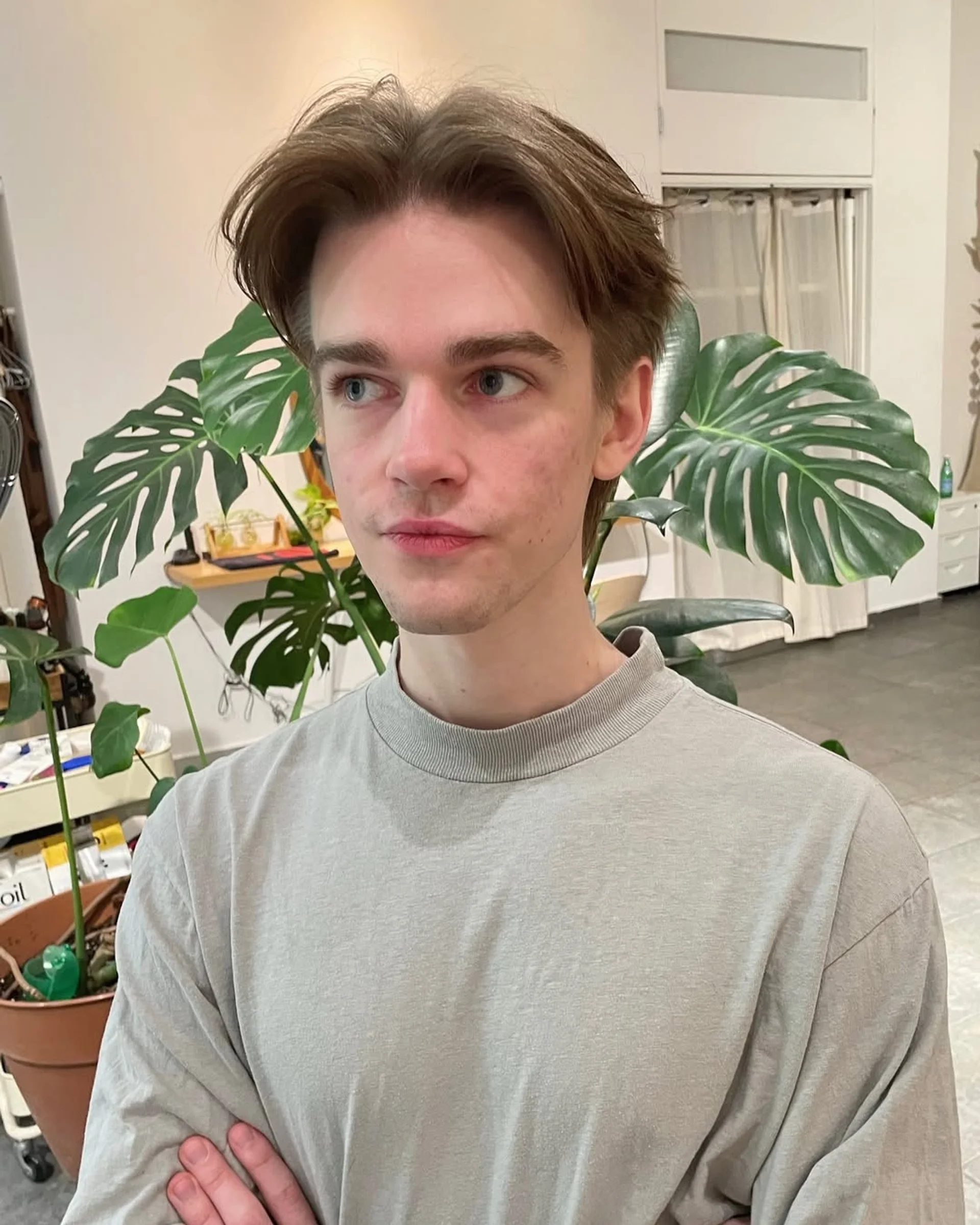 Male model with a modern shag haircut and curtain bangs - Preview 2