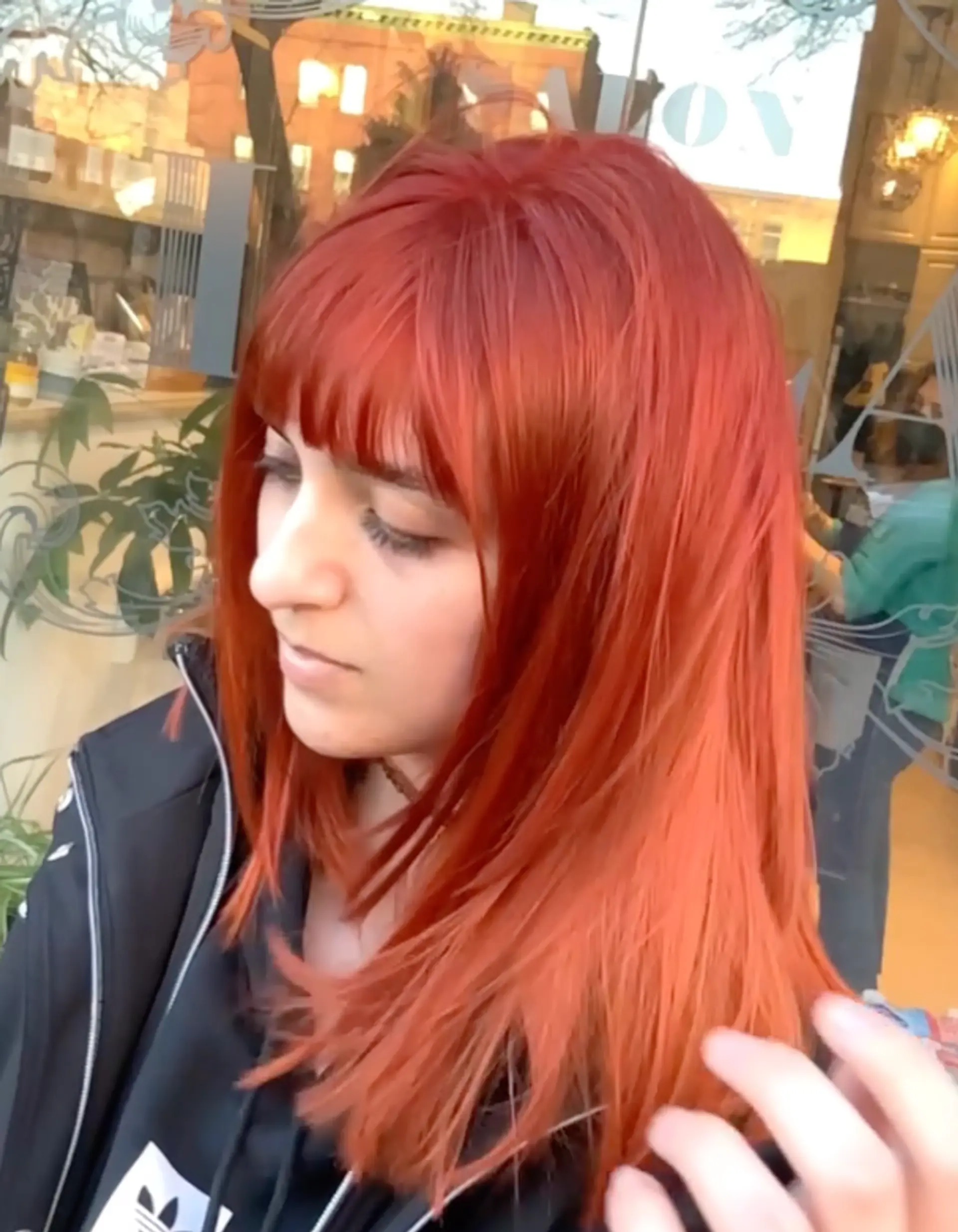 A medium-length layered shag with full bangs. 1