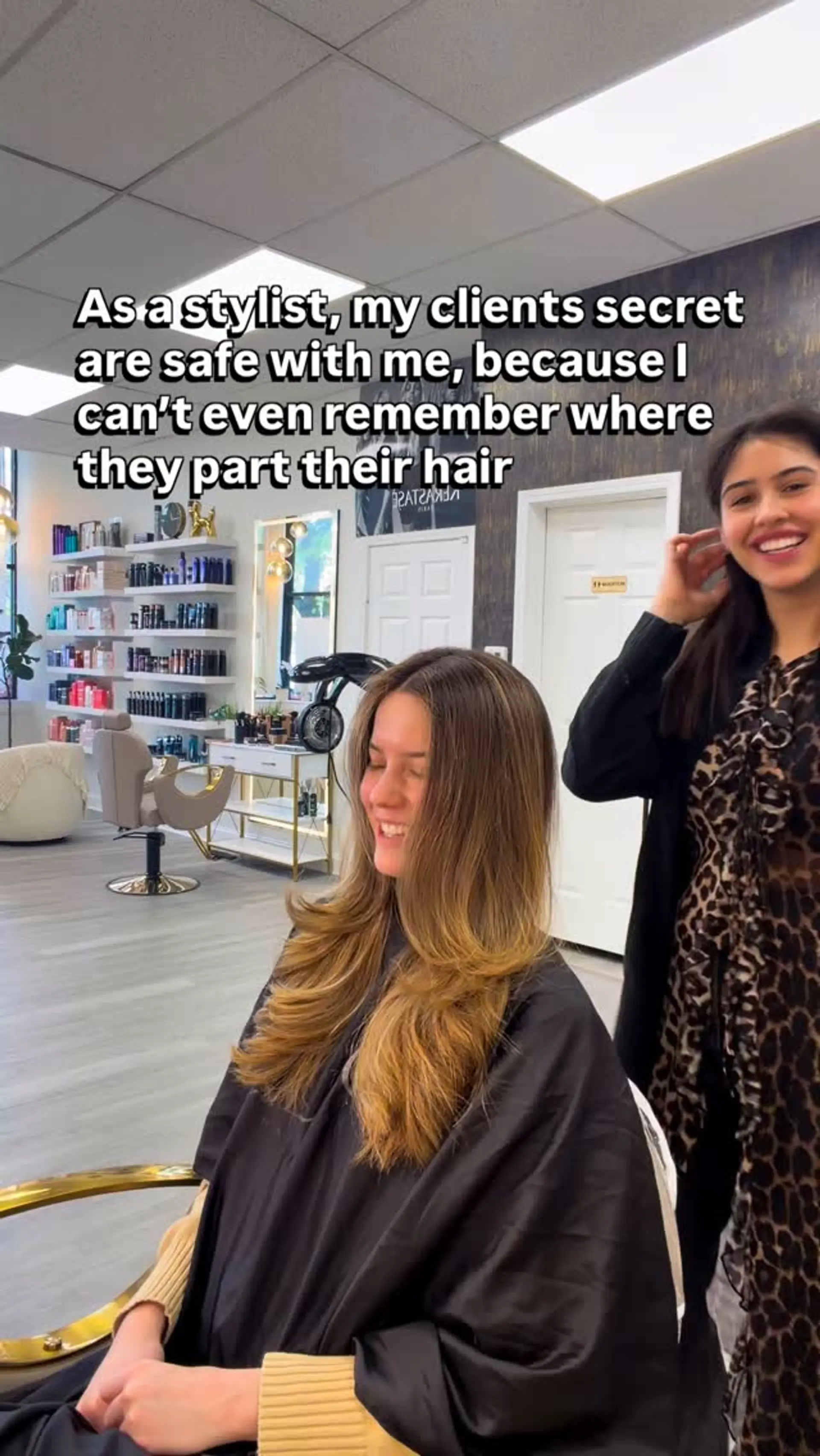 Long layered hair styled in a bouncy blowout with soft face-framing layers and flipped ends. 1