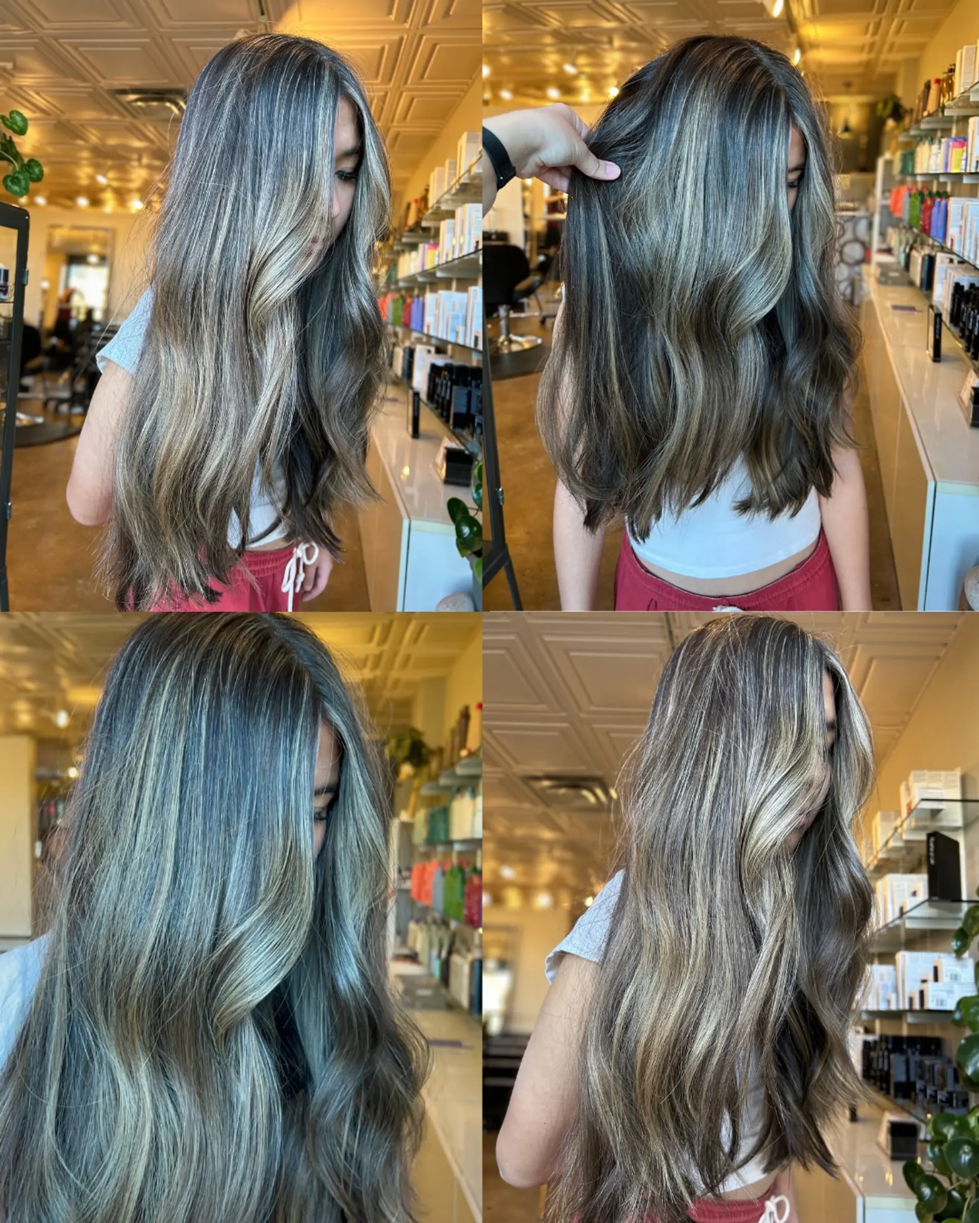 Long wavy hair featuring a seamless dimensional bronde blend of cool blonde highlights over a dark brunette base. 1