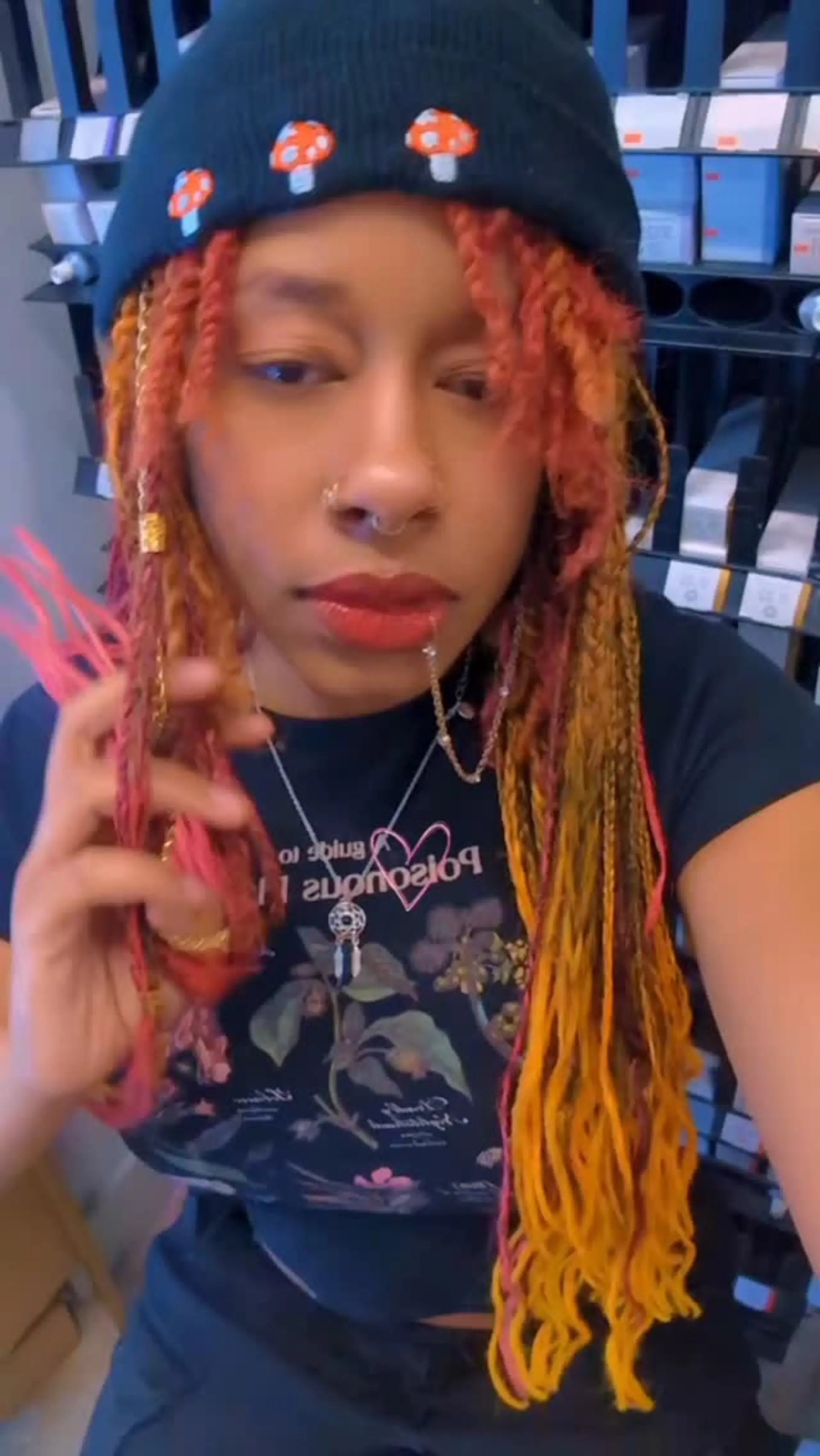 Long colorful two-strand twists and braids decorated with gold cuffs and chain accessories. 1