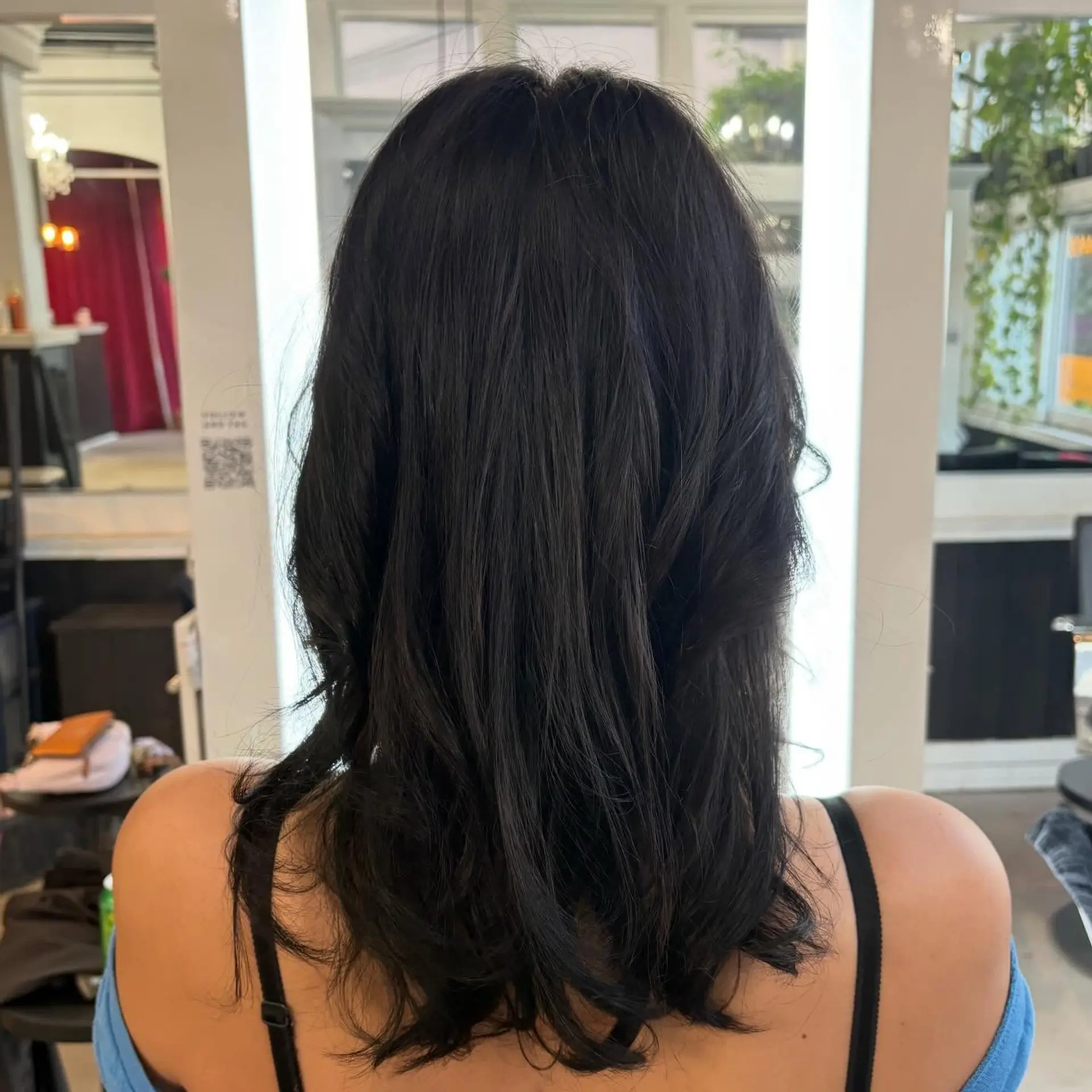 A sleek, voluminous medium-length blowout with gentle body and soft movement at the ends. 1