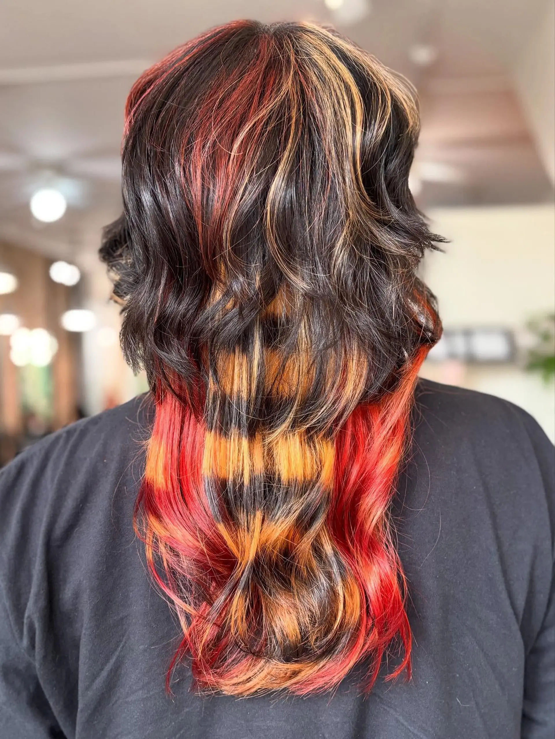 A layered alternative haircut featuring vivid calico coloring with raccoon tail horizontal stripe patterns. 1