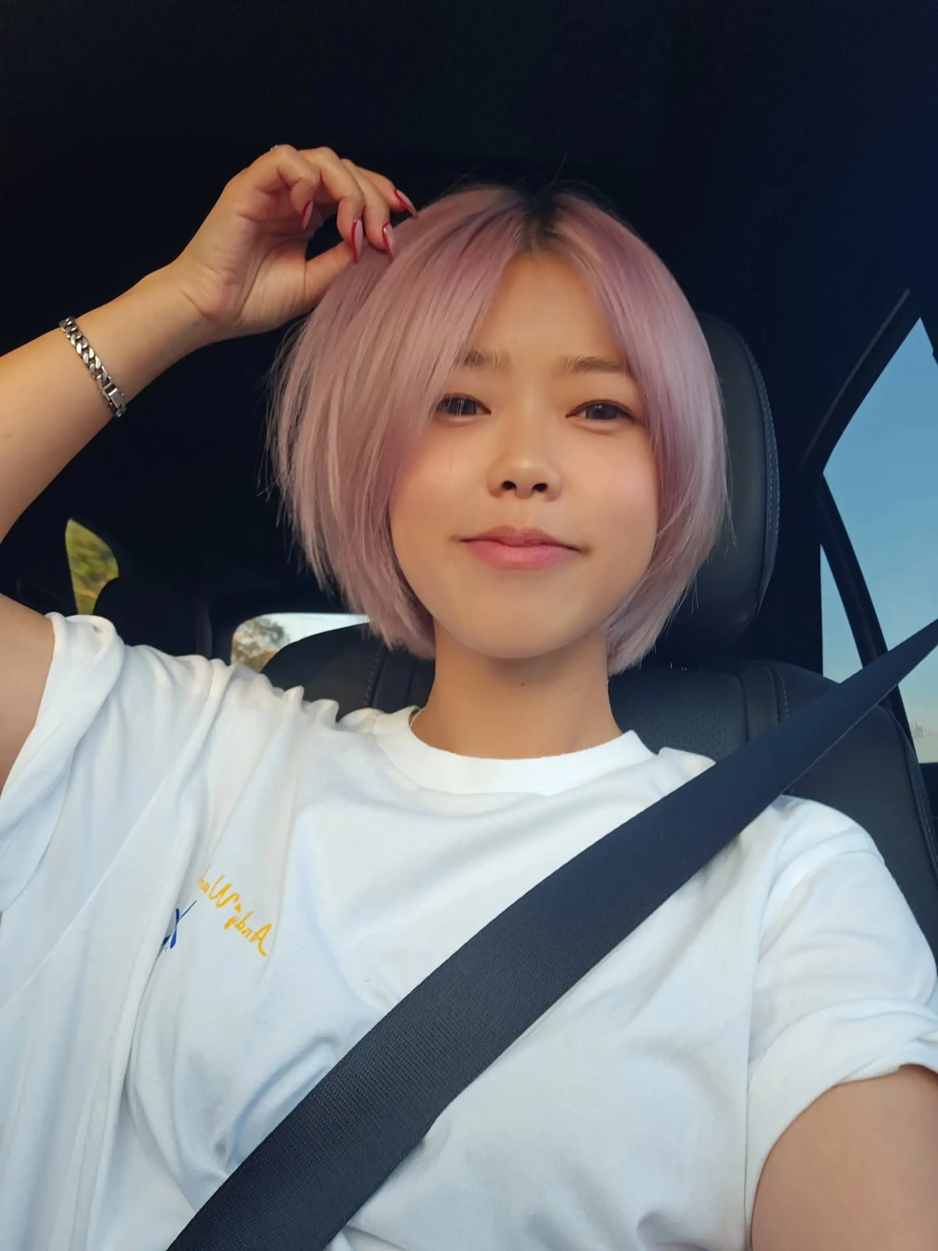 A sleek, chin-length short bob dyed in an ethereal pastel lilac-pink shade. 1