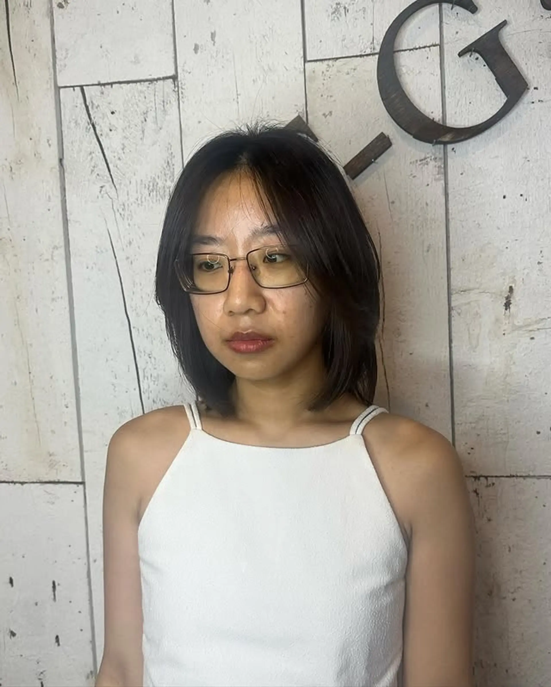 A stylish layered bob with soft, face-framing bangs. 1