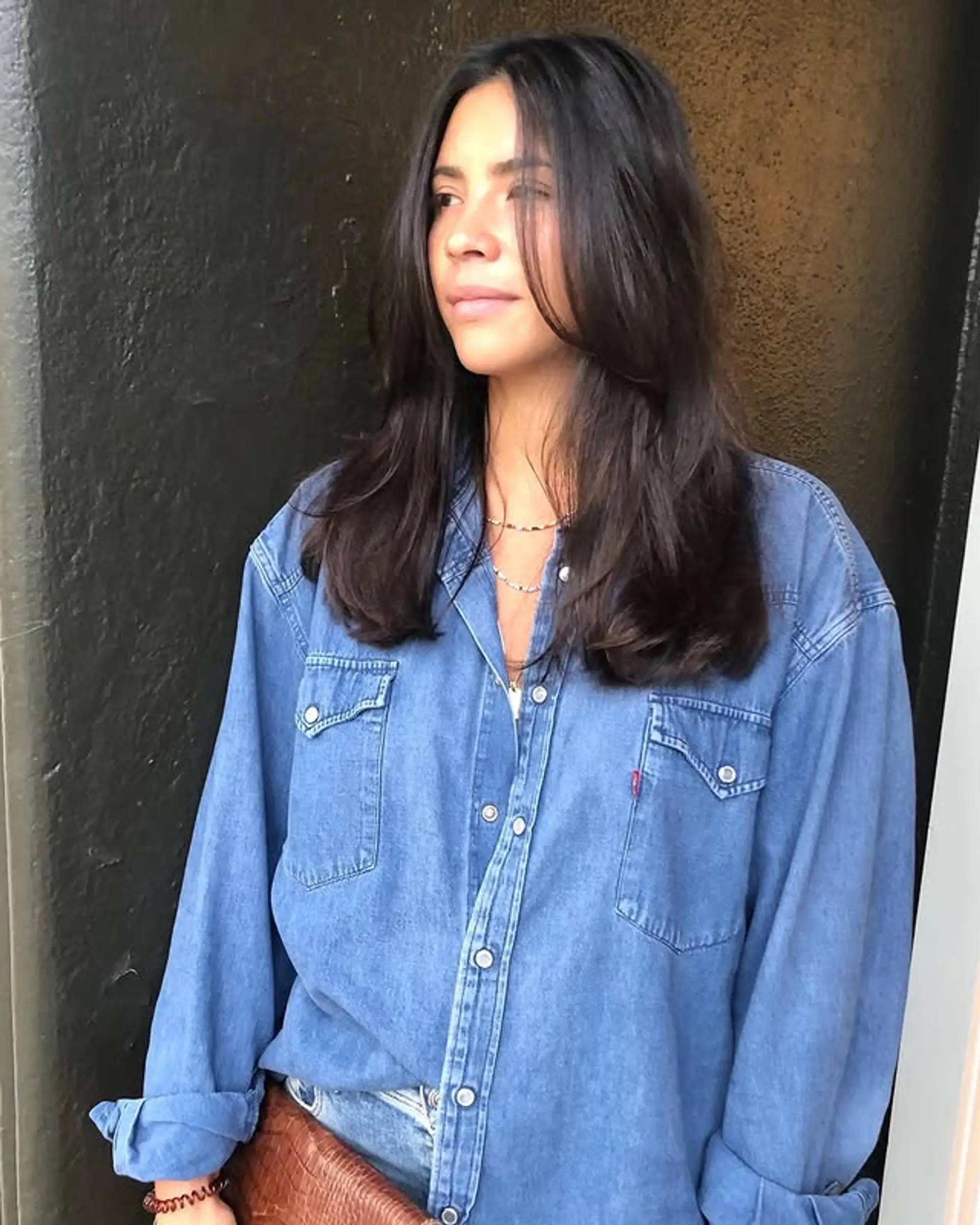 Long layered cut with face-framing bangs and textured ends. 1