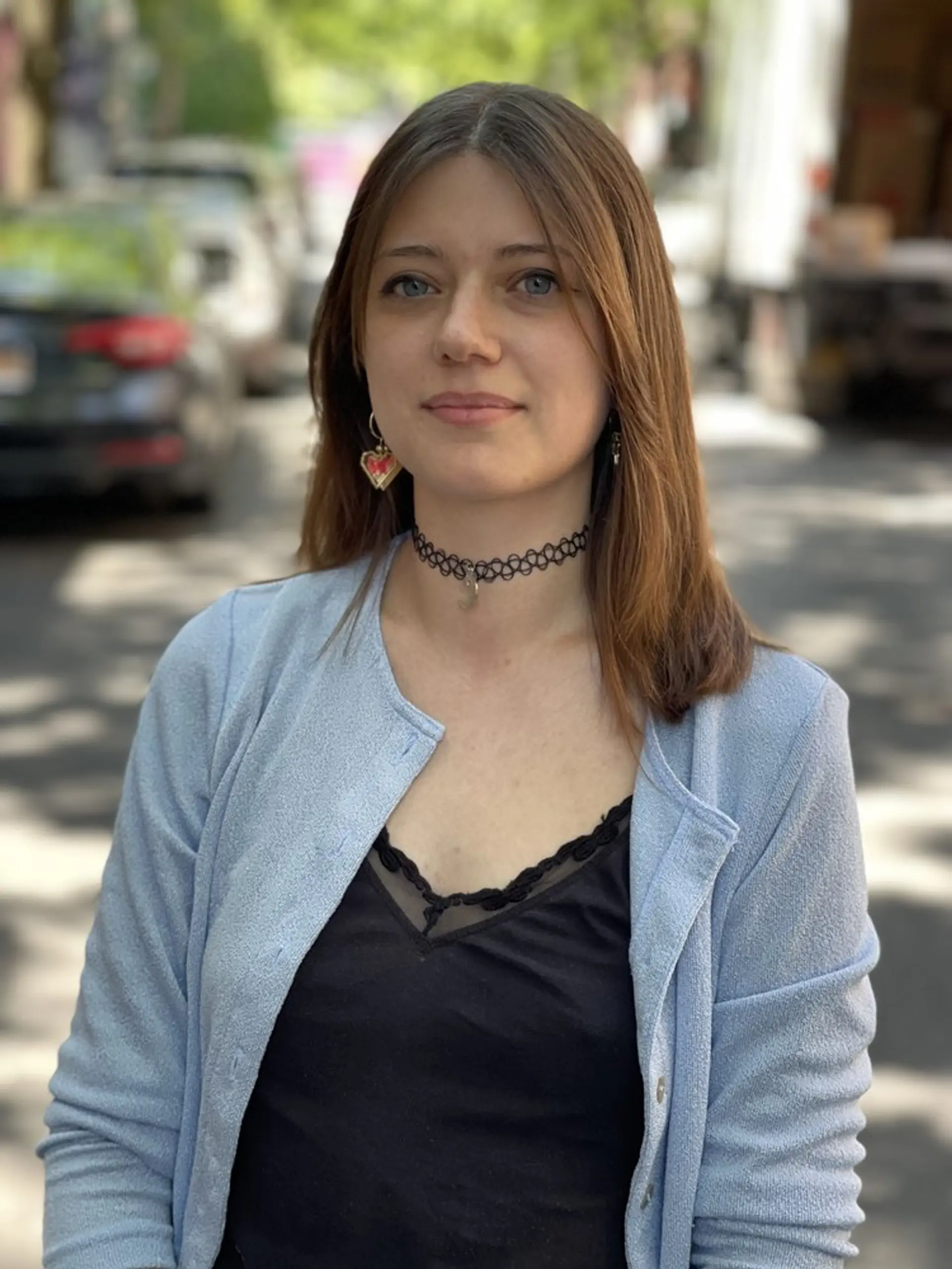 A medium-length, straight hairstyle with subtle layers for added movement. 1